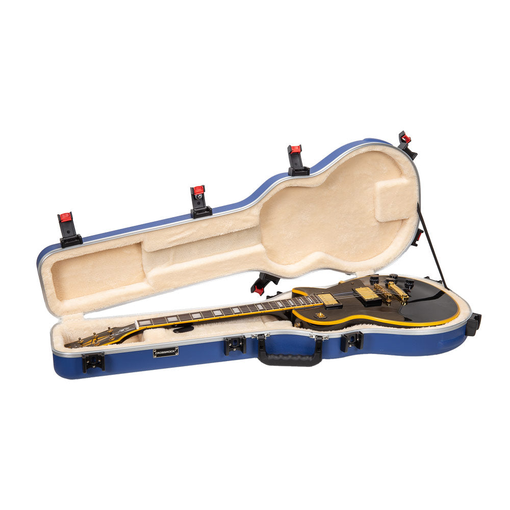 Crossrock CRA980LVB Vibrant Blue case open with a black Les Paul-style guitar resting in the beige plush interior.