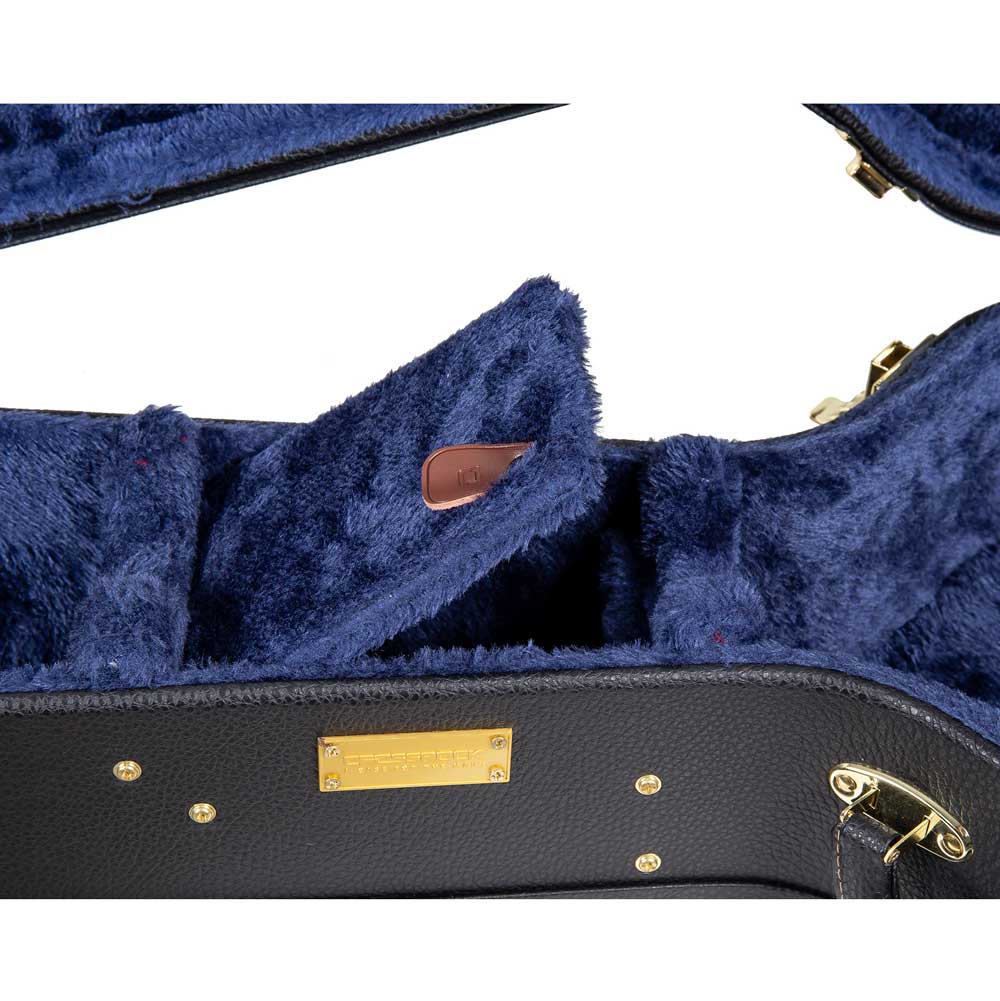Crossrock CRW620-0012BK black wood parlor guitar case close-up of the blue plush interior and accessory compartment lid with pull tab.