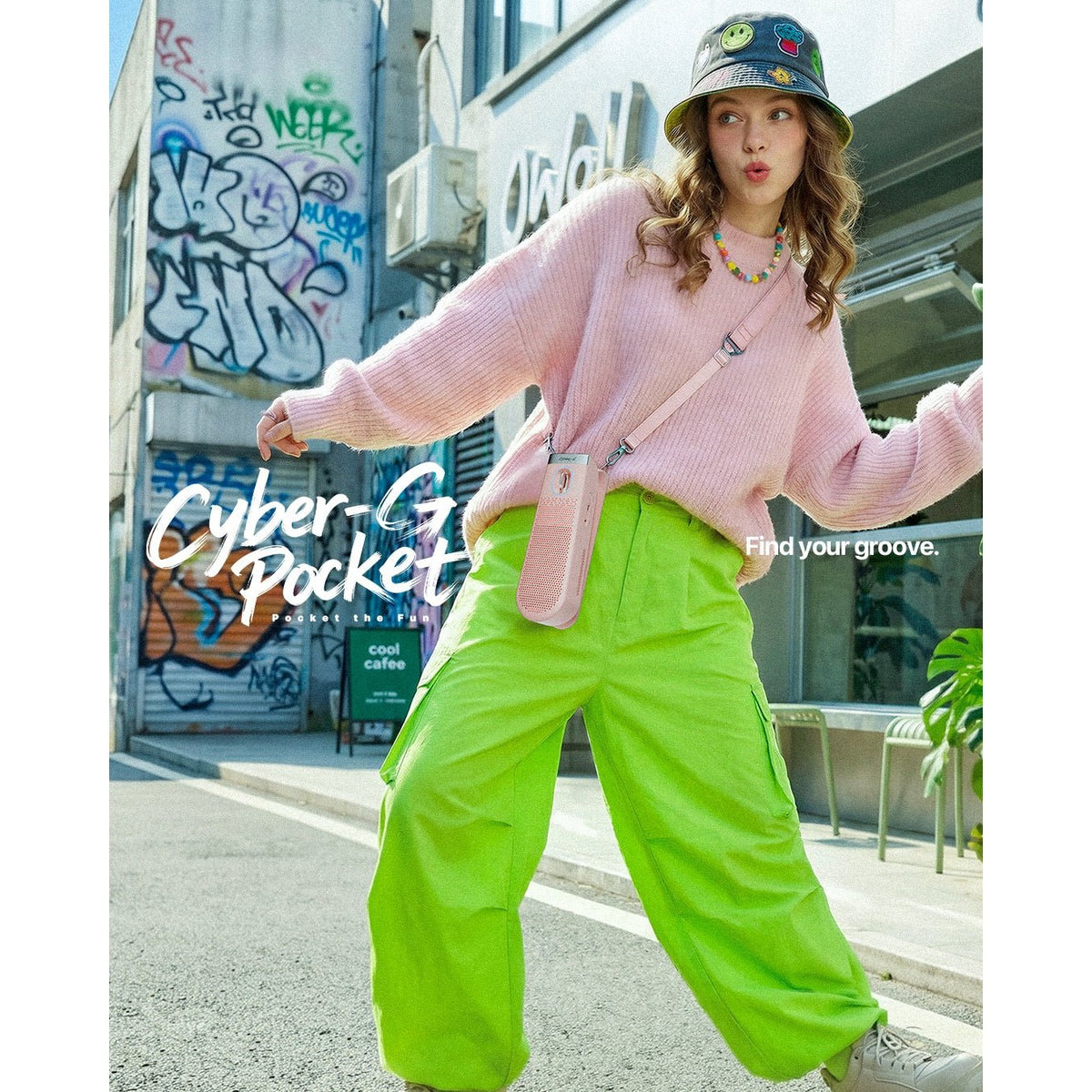 Player wearing the Enya Cyber-G Pocket in Pink on a shoulder strap on a city street