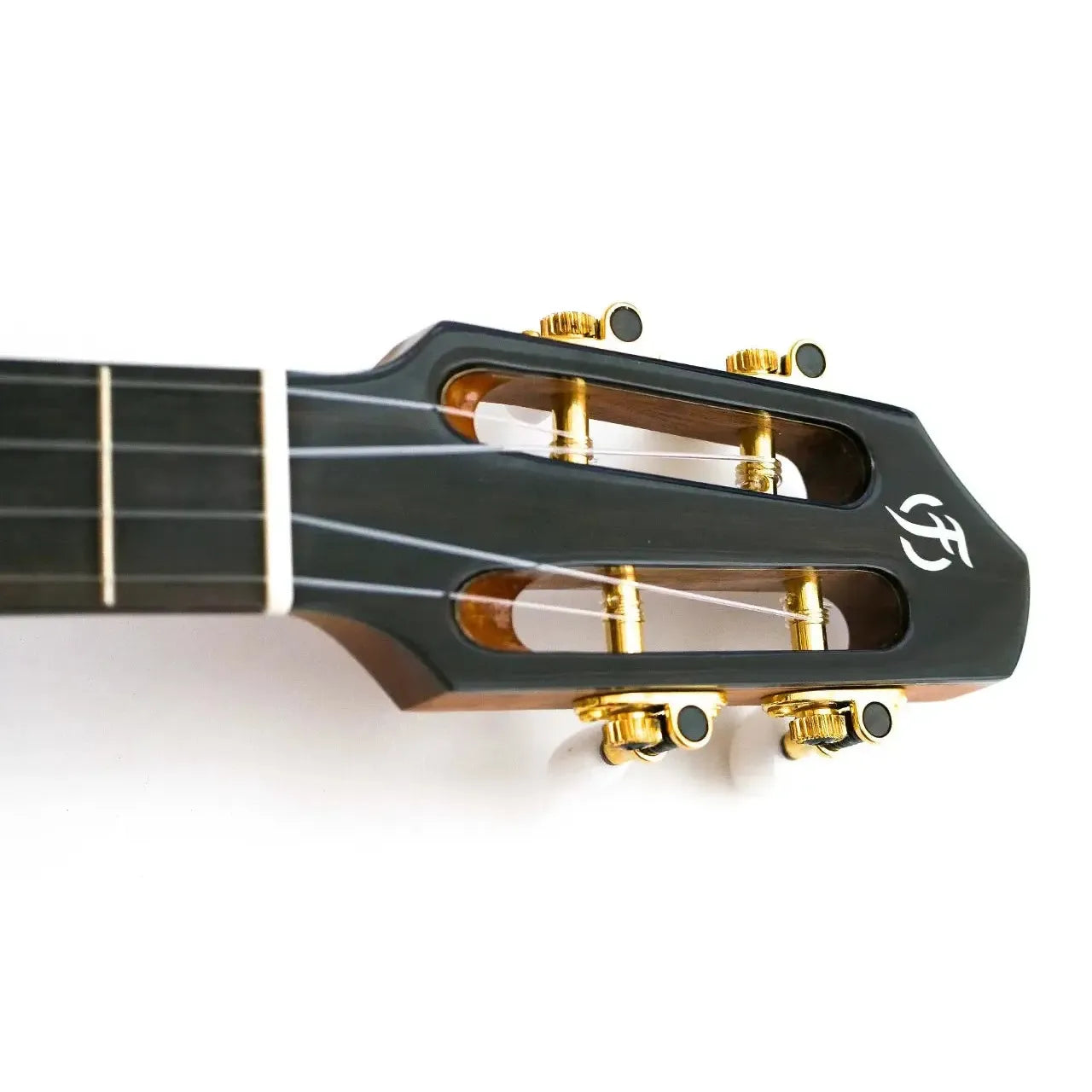 Flight A10 SC Tenor Ukulele slotted headstock with gold tuners and white logo on dark wood.