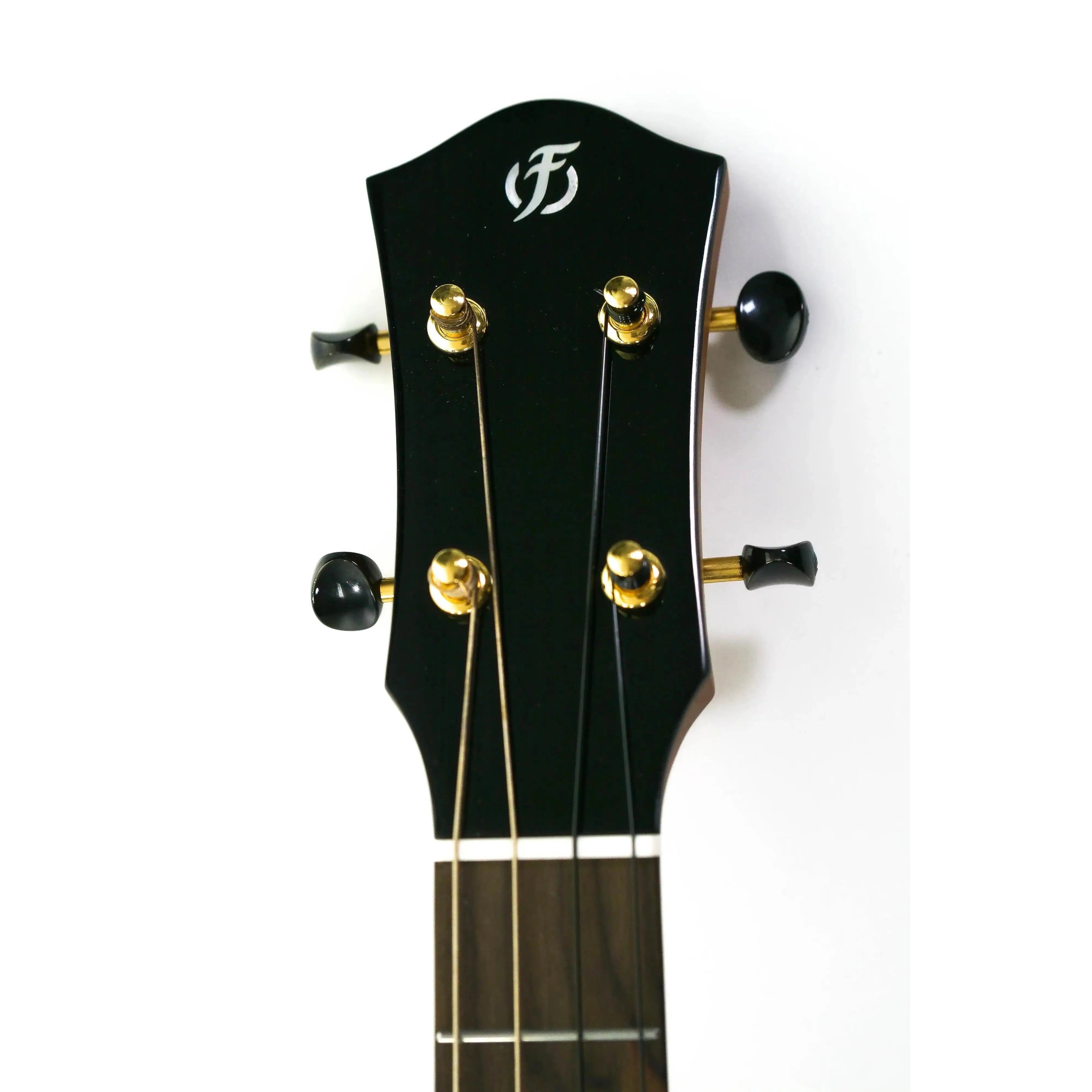 Flight Aurora EQ-A Baritone Ukulele headstock with black finish, gold tuners, and white Flight logo.