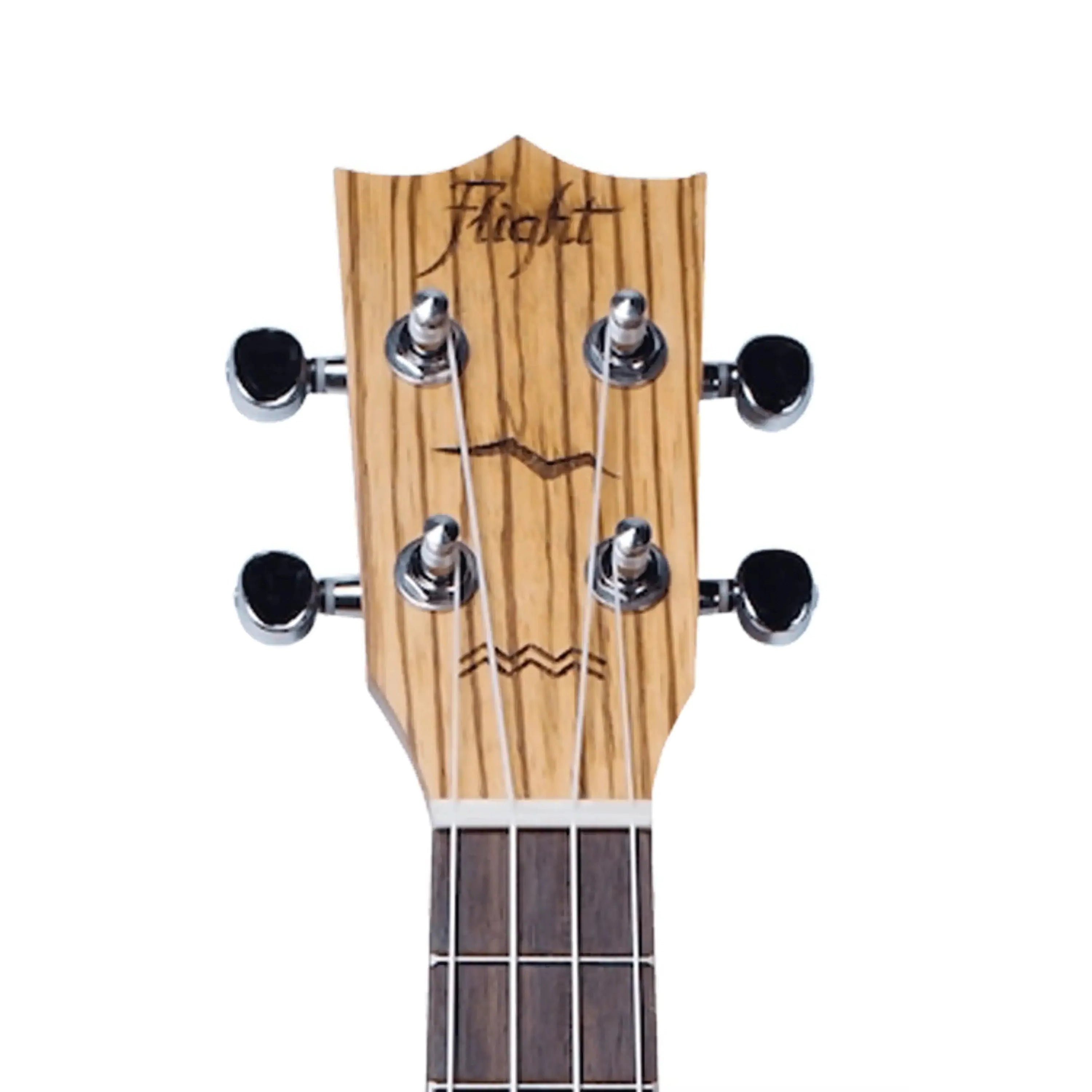 Flight DUC325 SP/ZEB Concert Ukulele headstock with zebrawood grain, chrome tuners, and Flight logo.
