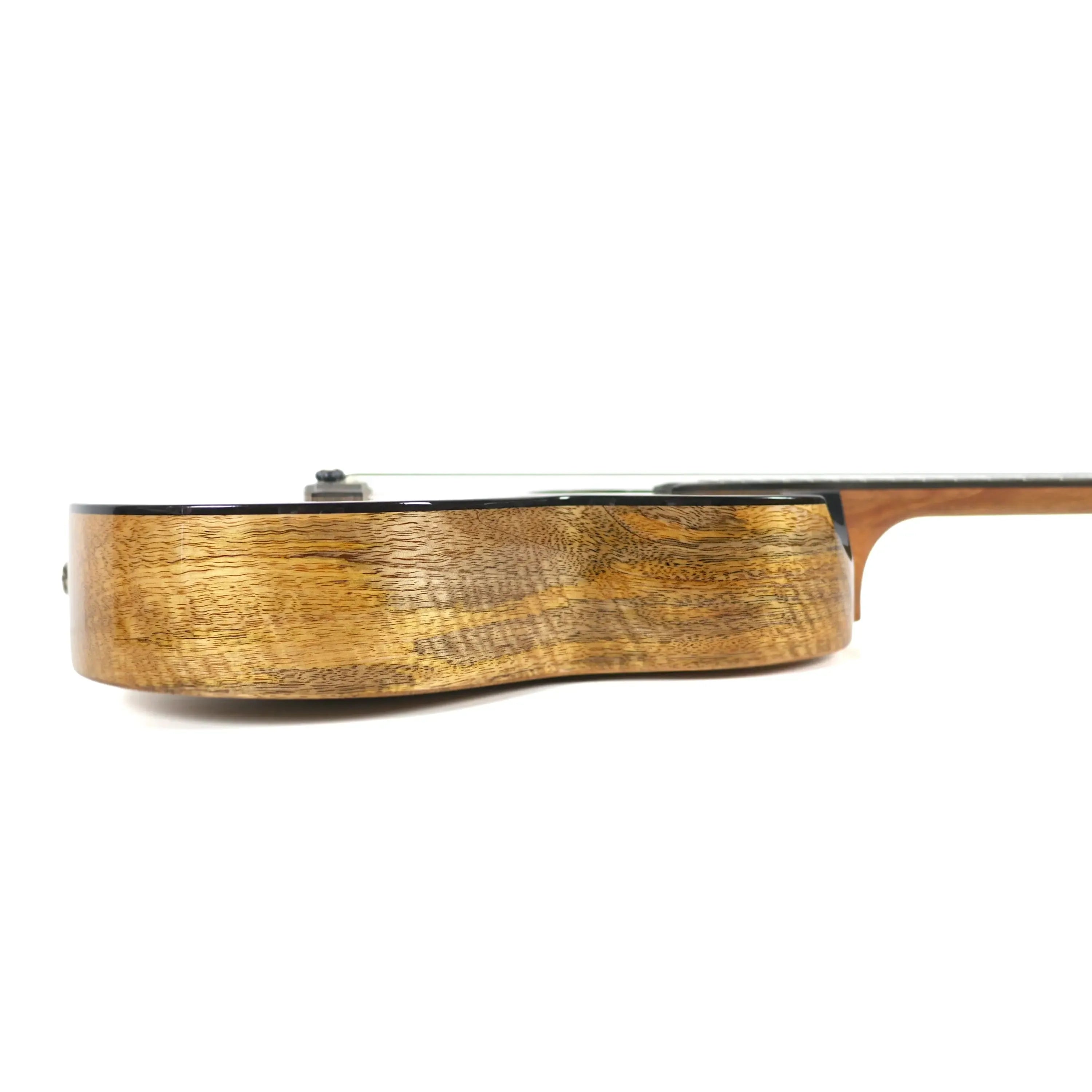 Flight Fireball solid mango baritone ukulele, showing the glossy, wood-grained side and black binding.
