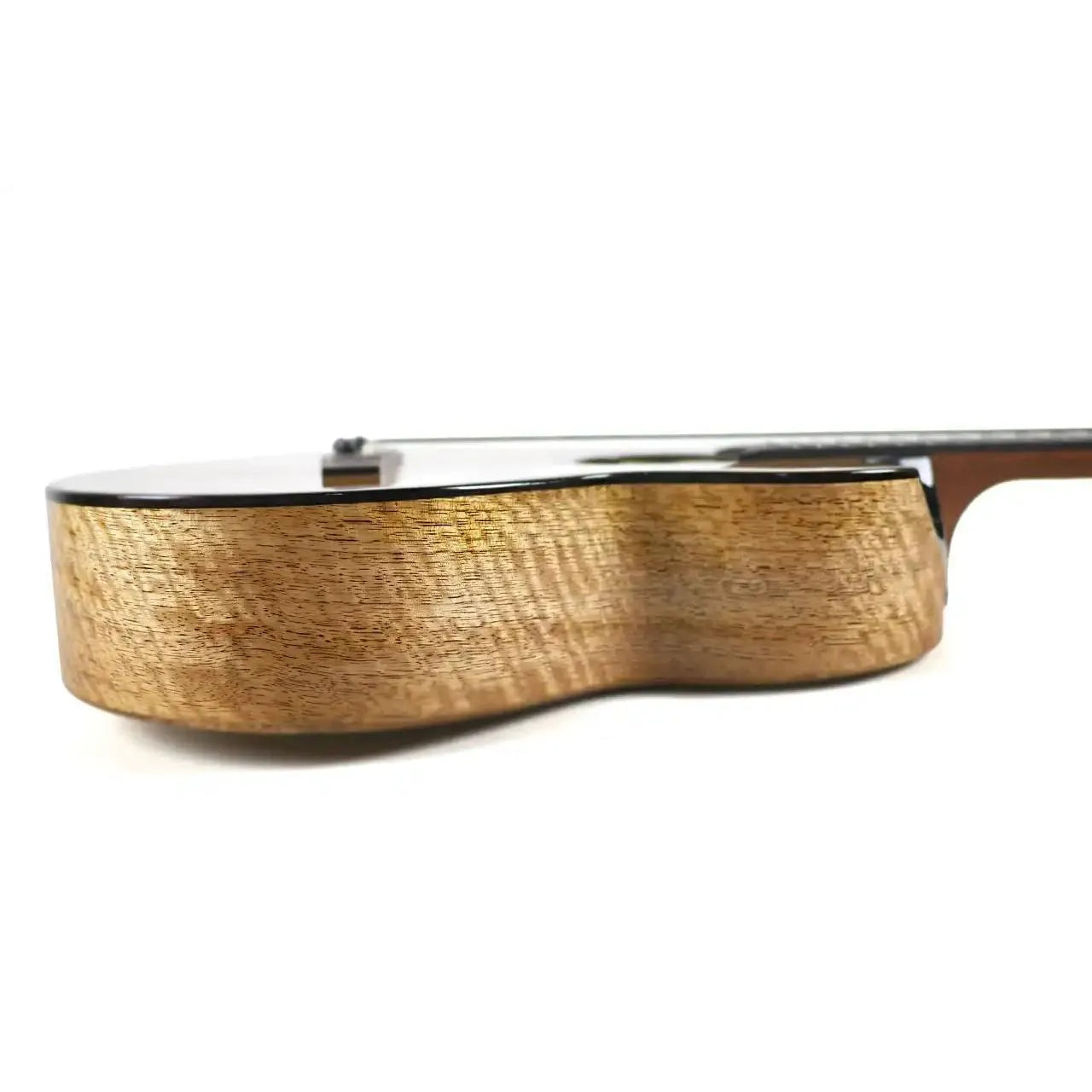 Side view of Flight Fireball EQ-A Baritone Ukulele, showcasing its solid mango wood body with a gloss finish.