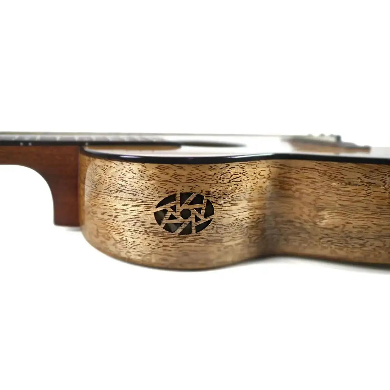 Flight Fireball EQ-A solid mango baritone ukulele body with a unique soundhole design.
