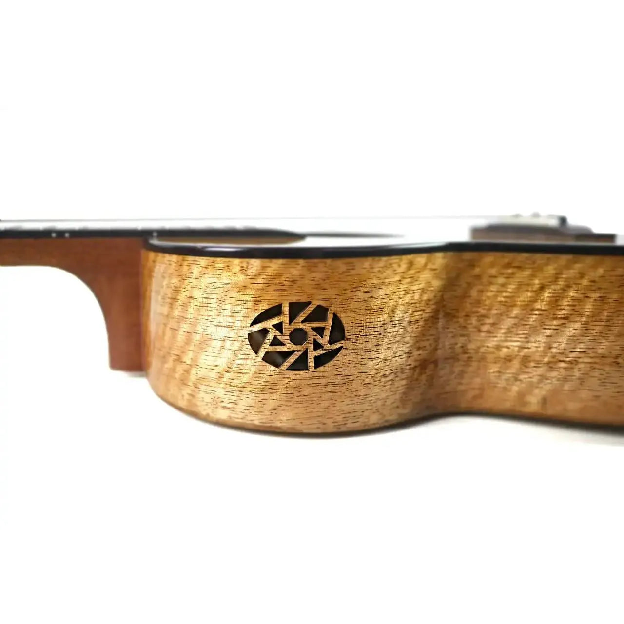 Flight Fireball EQ-A solid mango baritone ukulele side view, showing the unique rosette soundhole.