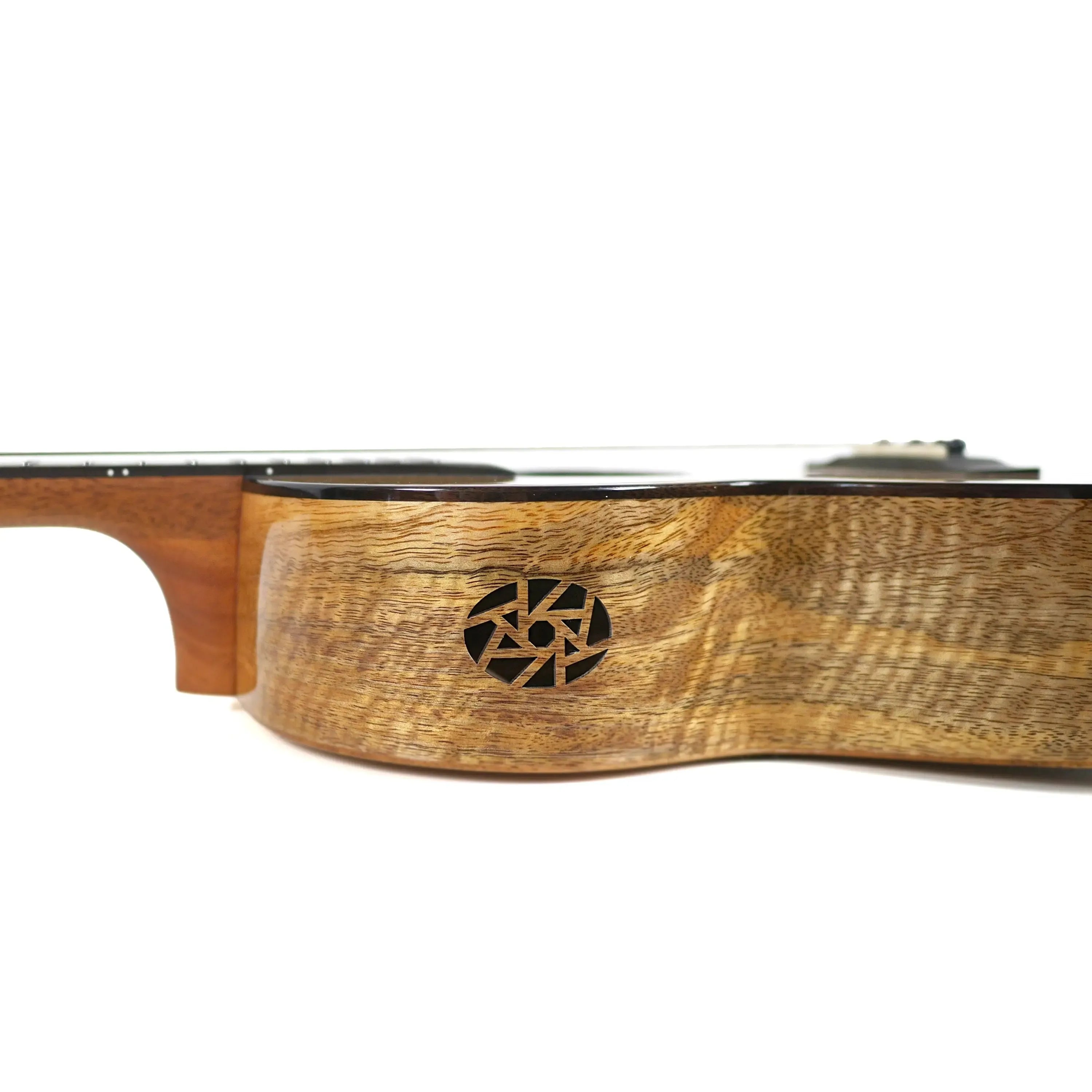 Flight Fireball Baritone Ukulele, solid mango wood body with unique rosette, side view.