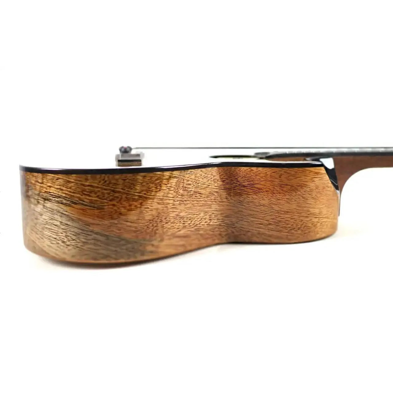 Flight Fireball EQ-A solid mango tenor ukulele body, showing rich wood grain and dark binding.