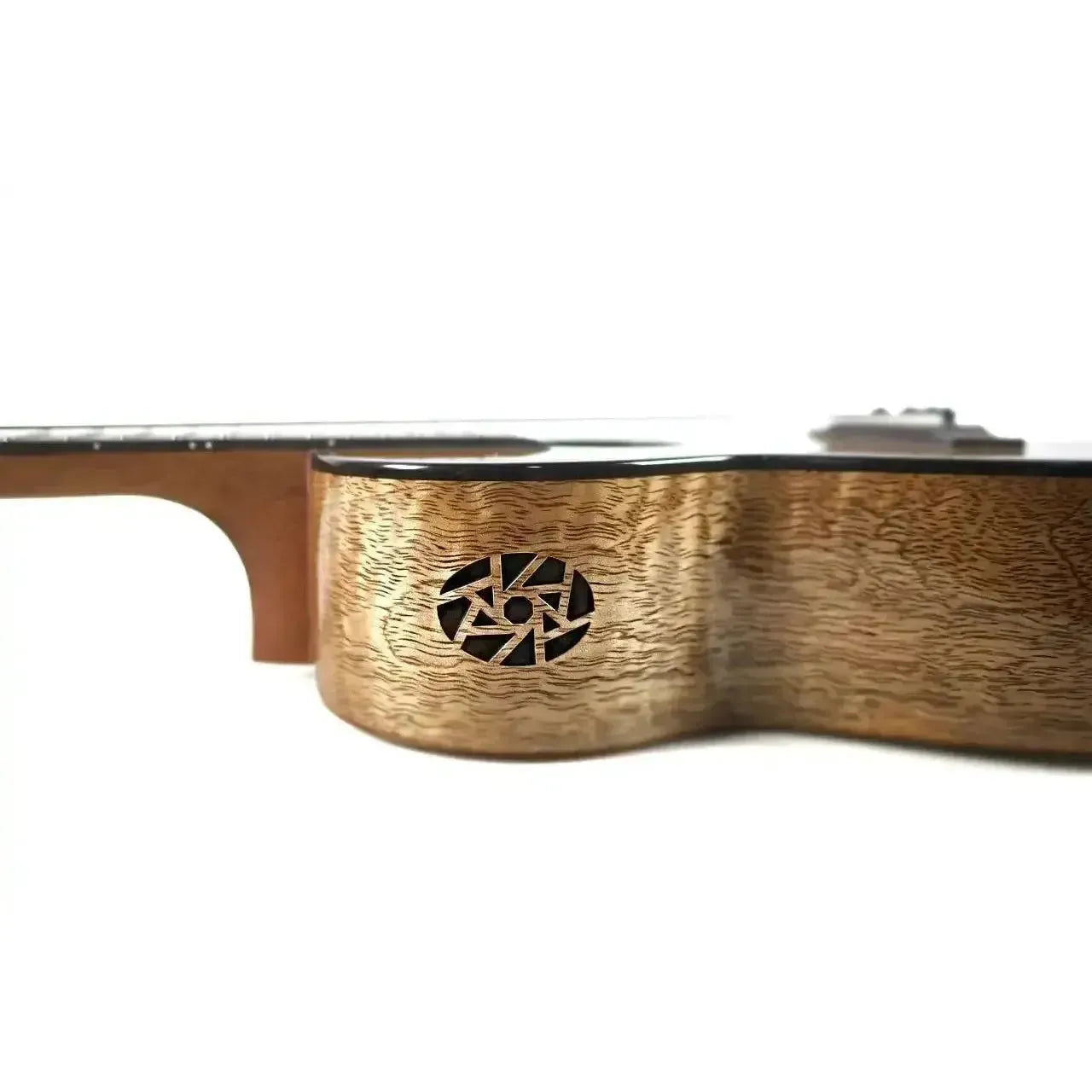 Flight Fireball EQ-A Tenor Ukulele side view, showing its solid mango wood body with a unique soundhole design.