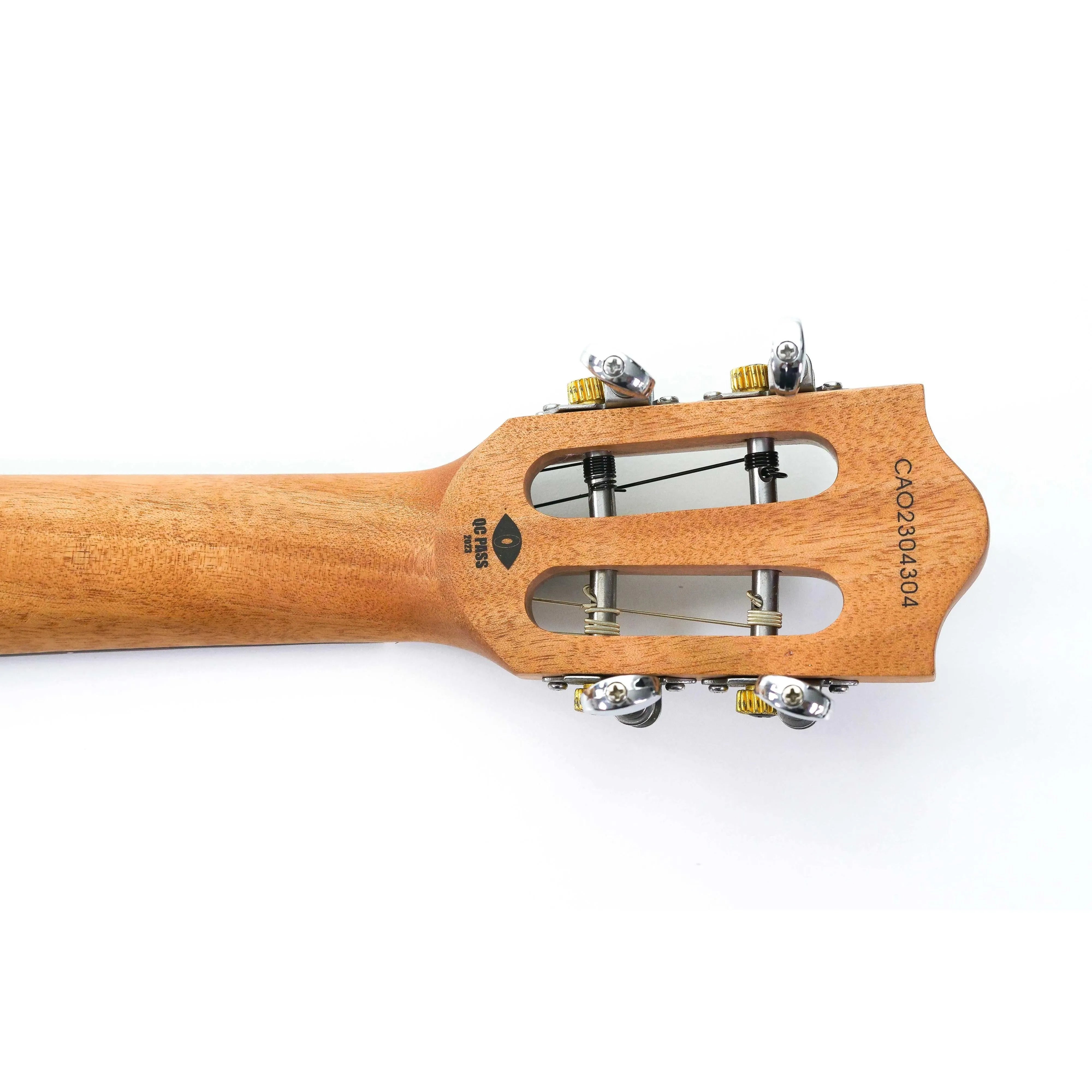 Flight IRIS BK Baritone Ukulele headstock with open-gear tuners and "QC PASS" stamp.