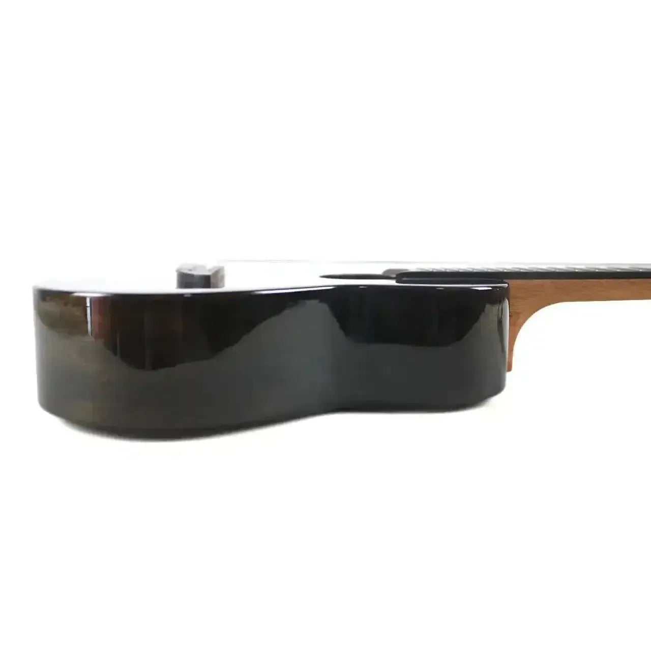 Side view of a Flight IRIS TINTA TBK transparent black concert ukulele body with a glossy finish.