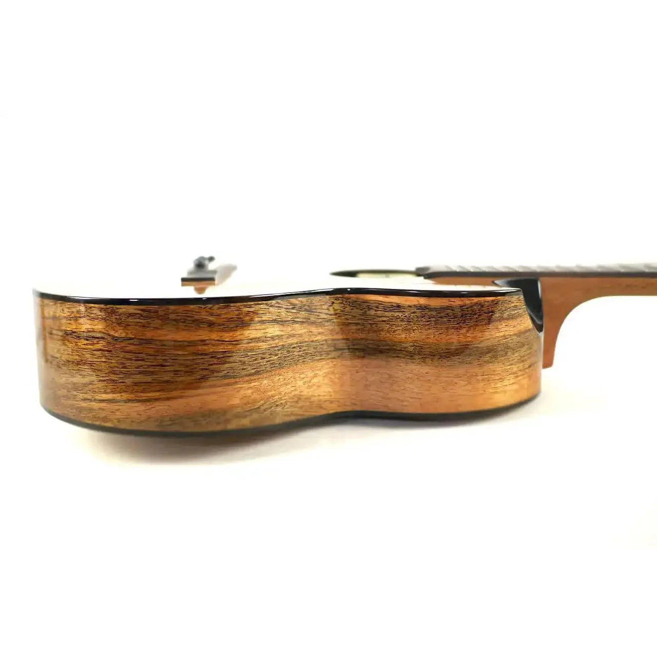 Flight Lily EQ-A Baritone Ukulele with solid cedar top and mango laminate sides, showcasing natural wood grain.