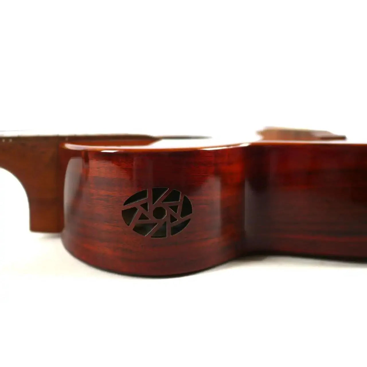 Flight Mustang EQ-A Tenor Ukulele side view, showing its glossy solid acacia body and unique sound port.