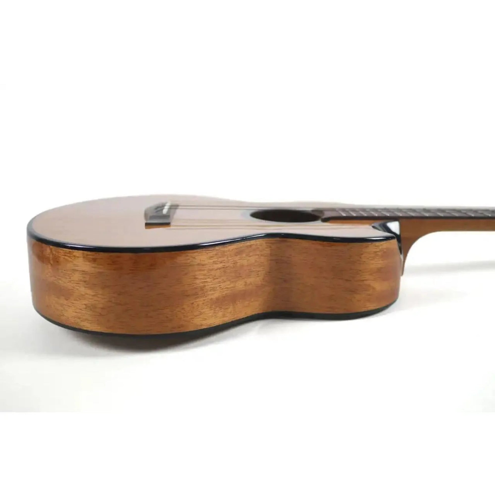 Flight Nomad Solid Mahogany Baritone Ukulele with glossy finish, rosewood neck, and soundhole.