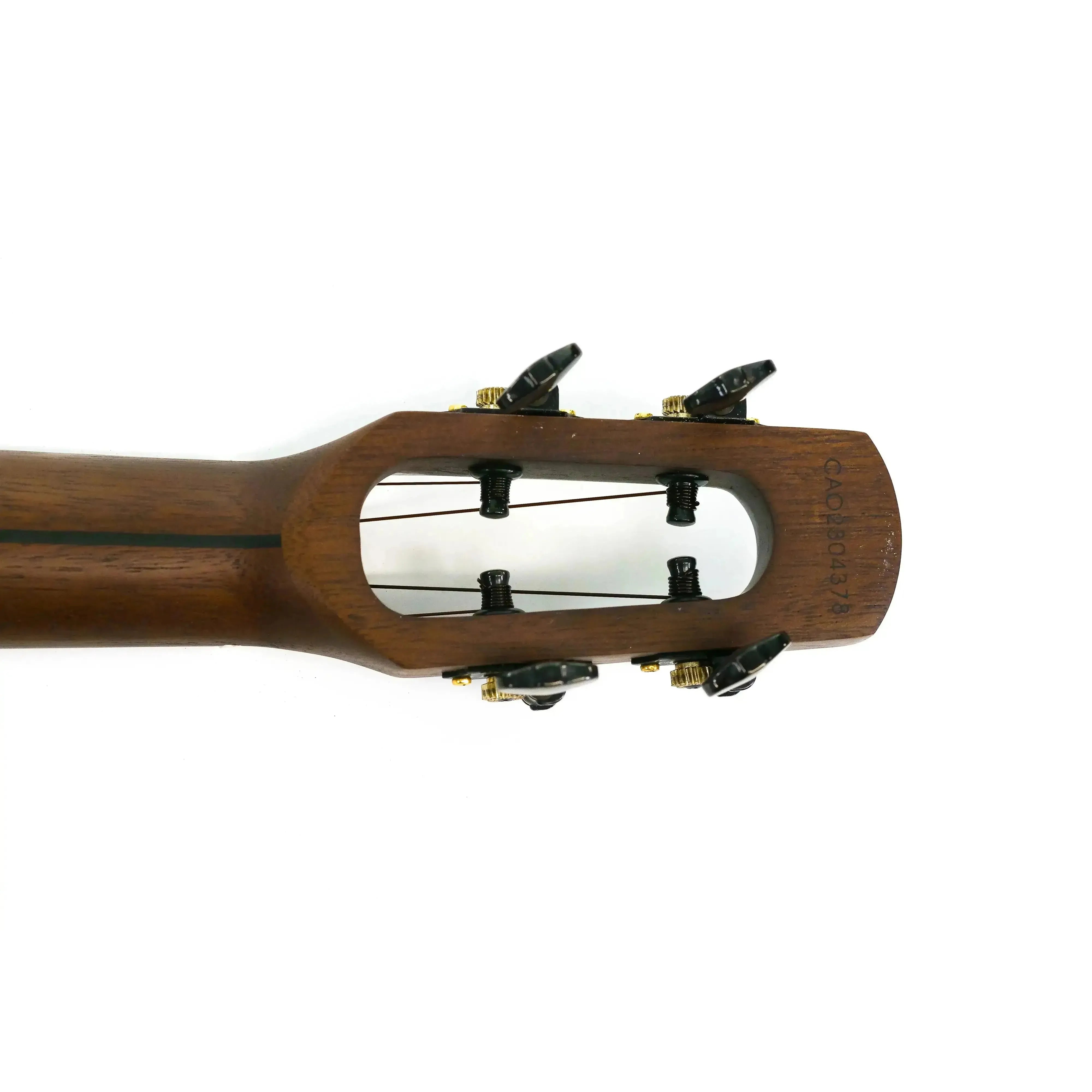 Flight Peter Moss Signature Tenor Ukulele headstock with unique shape, dark wood, and black tuners.