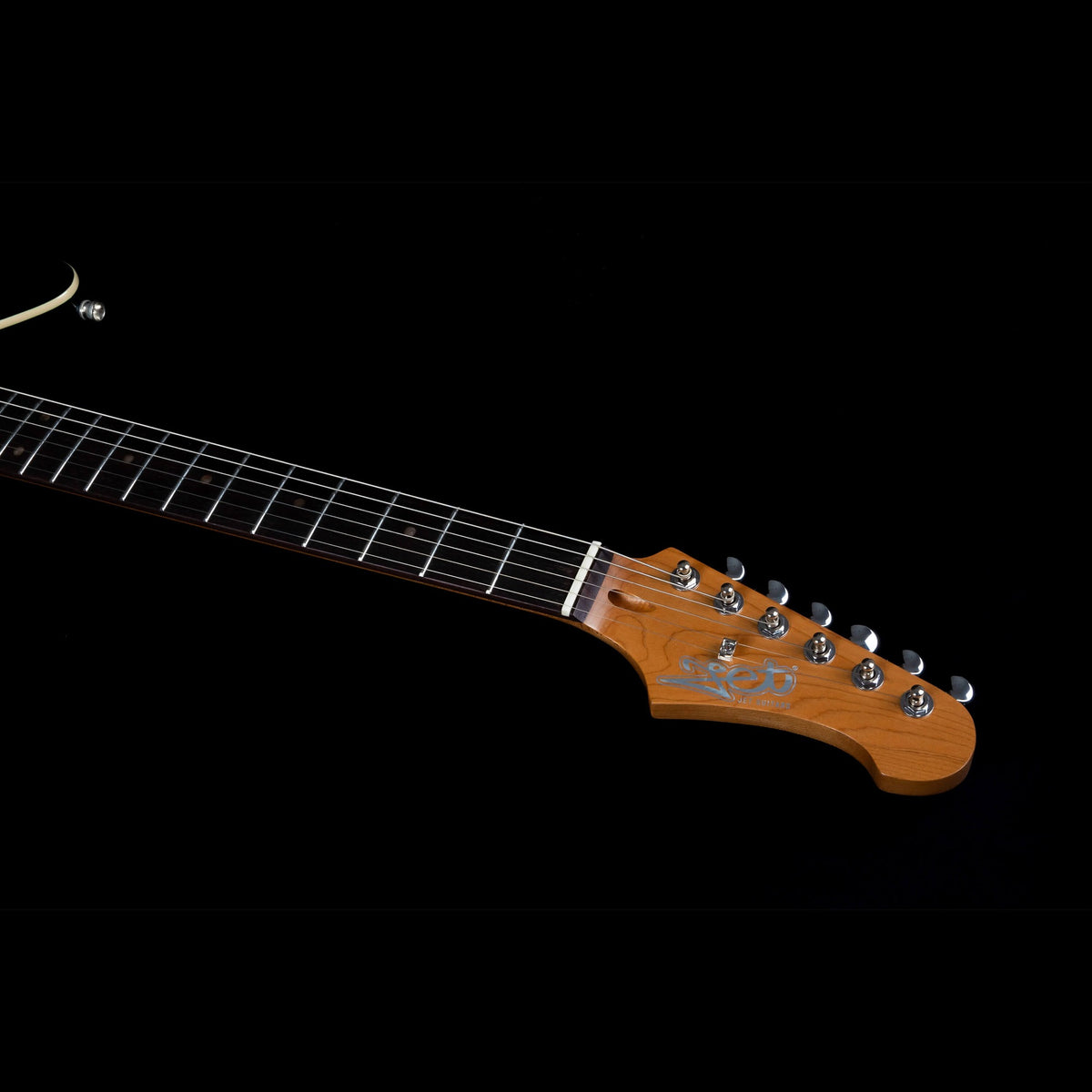 Jet JJ-350 GR R headstock and roasted maple neck viewed from the side.
