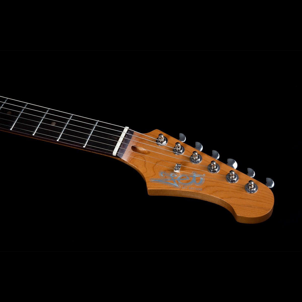 Jet JJ-350 GR R green offset electric guitar lying flat, front view with rosewood fretboard.