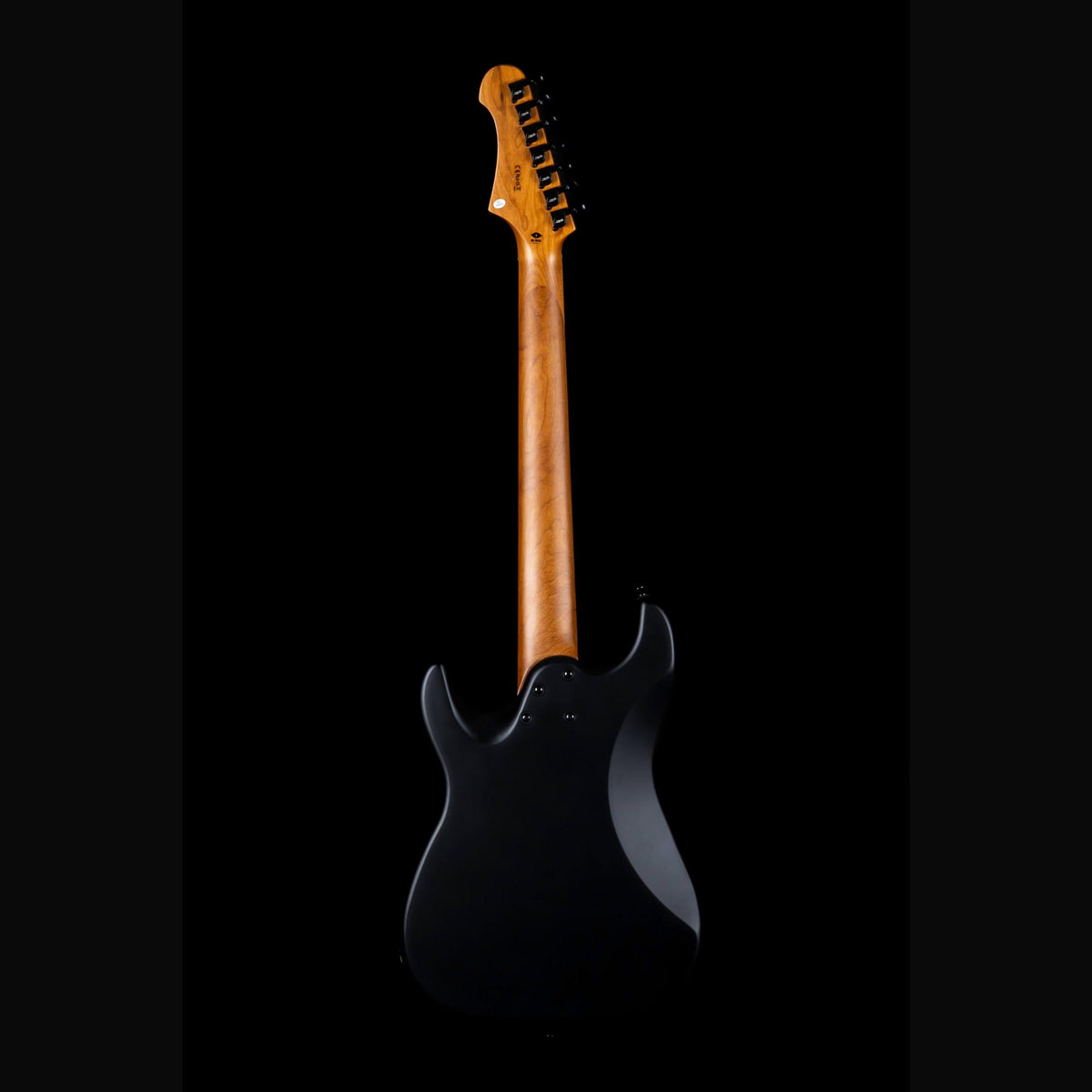 Jet JS-407 solid body electric guitar in matte black, full-length back view with a roasted maple neck
