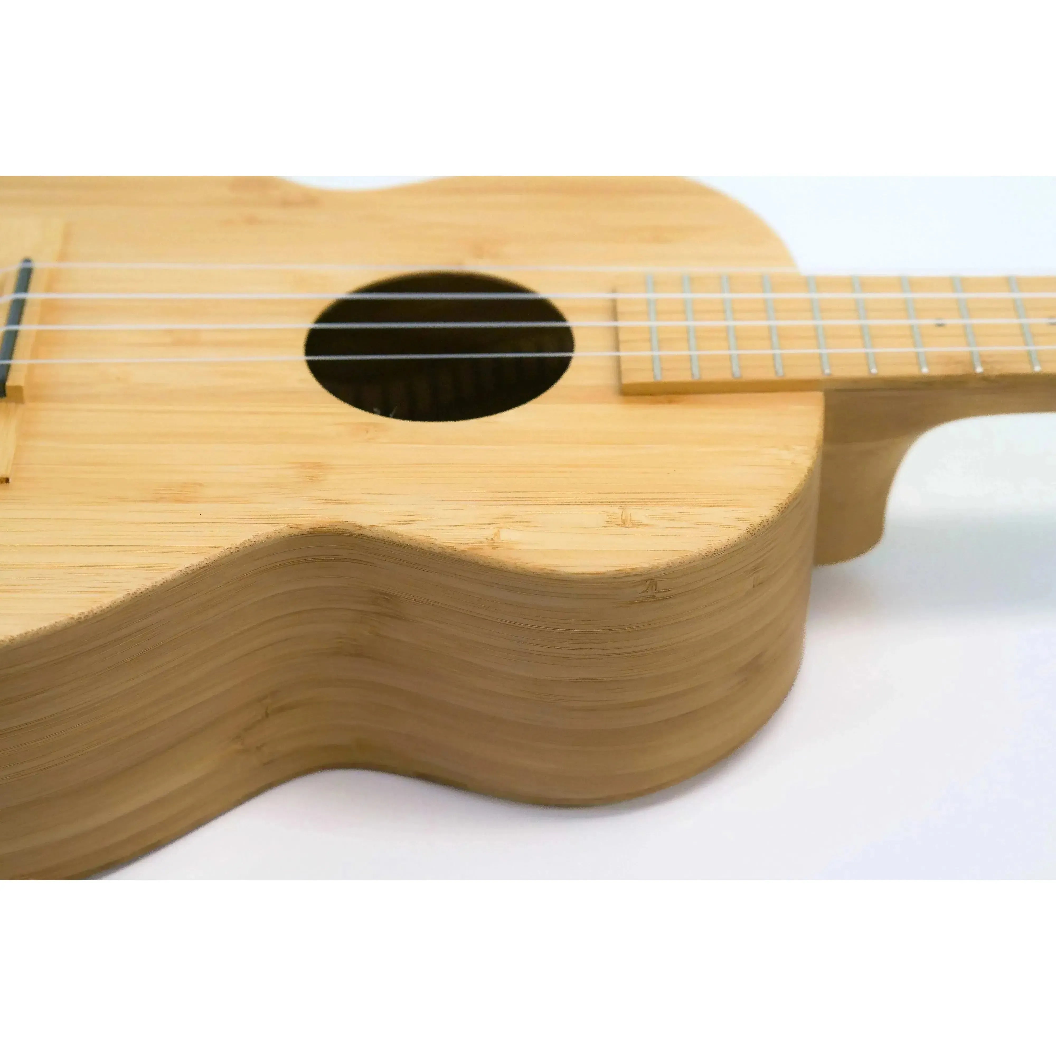 Kala BMB-T Solid Bamboo Tenor Ukulele body with natural wood grain and soundhole.