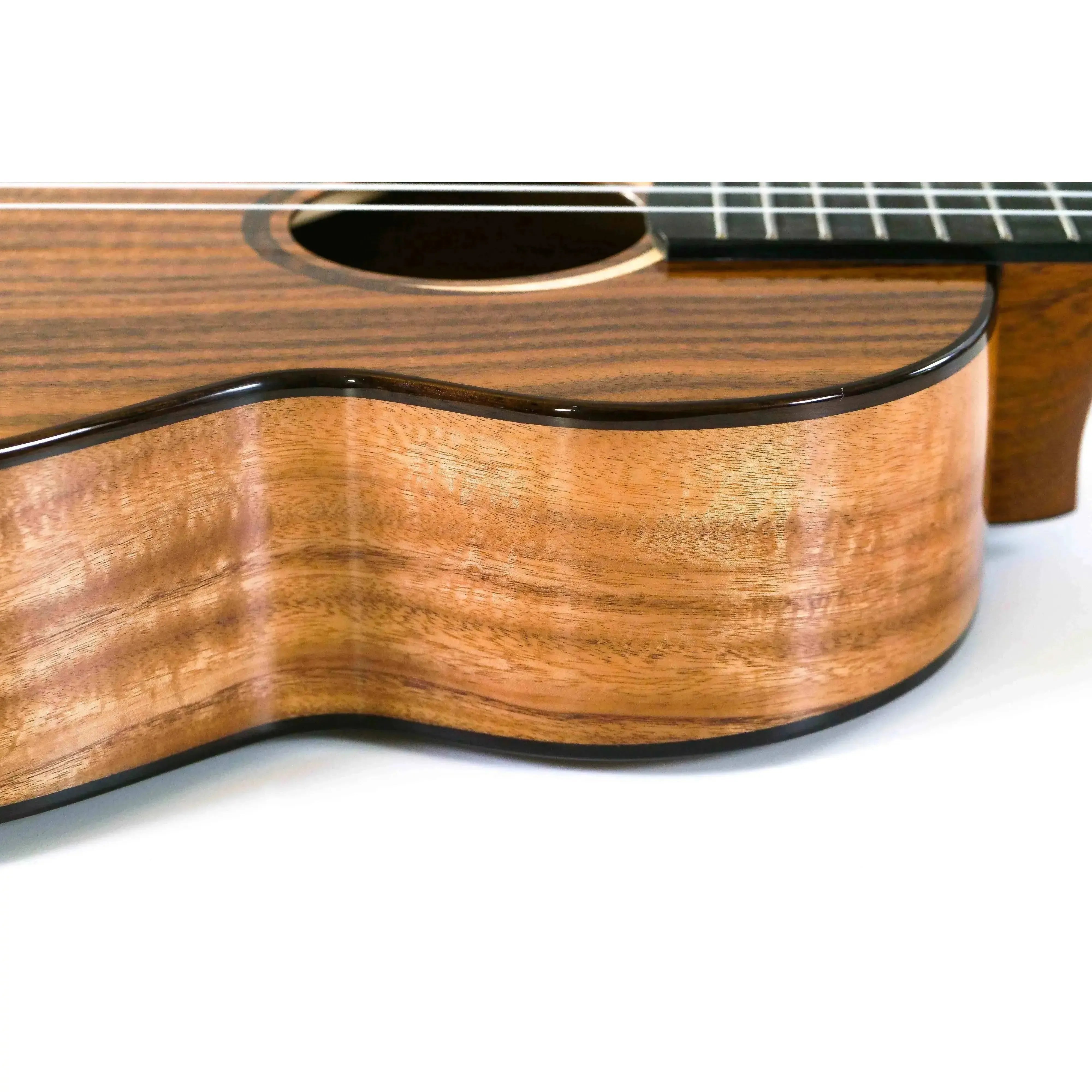 Kala Contour Series Baritone Ukulele with solid acacia body, rosewood binding, and ebony fingerboard.