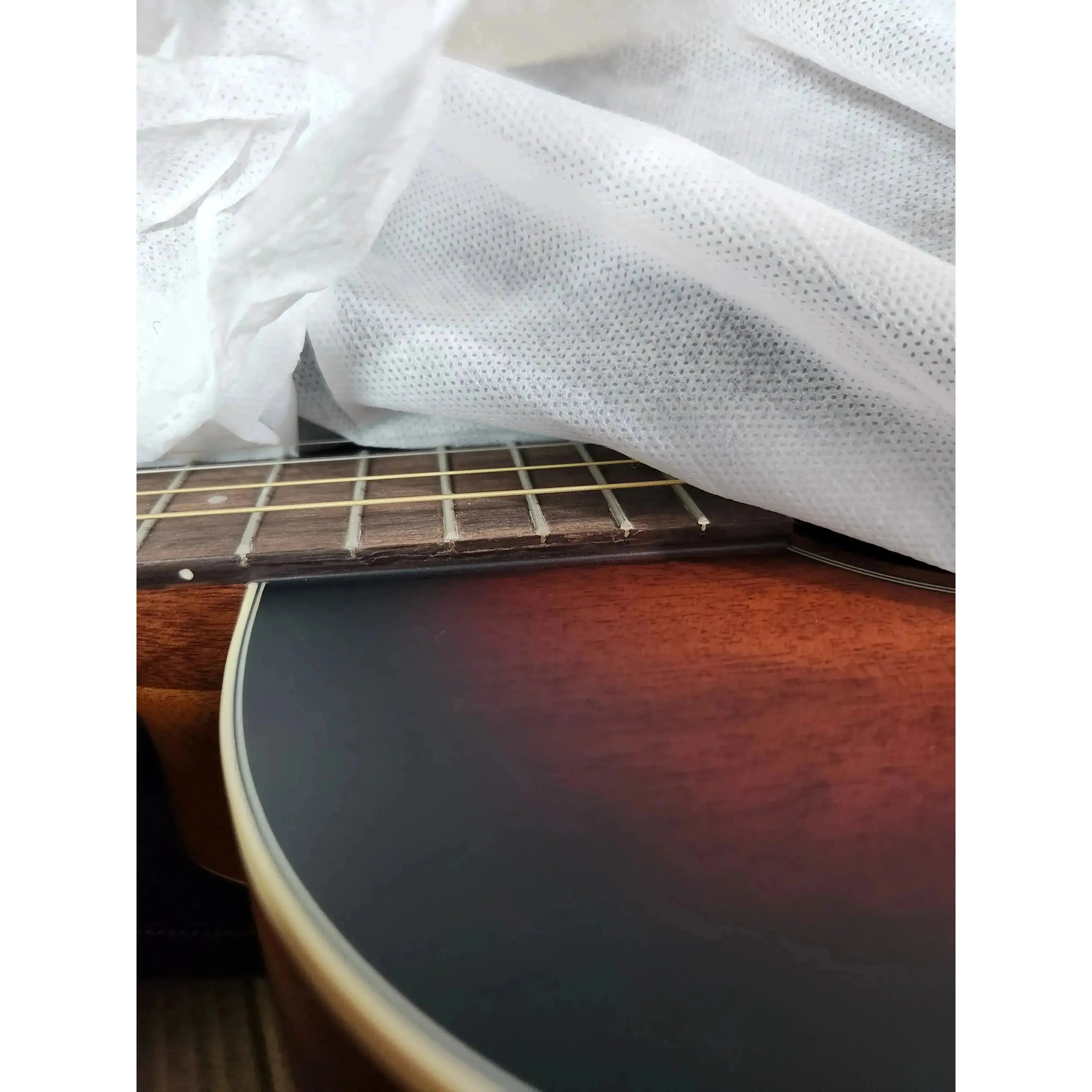 Kala GTR-TB Tenor Guitar with sunburst solid mahogany top and rosewood fretboard.