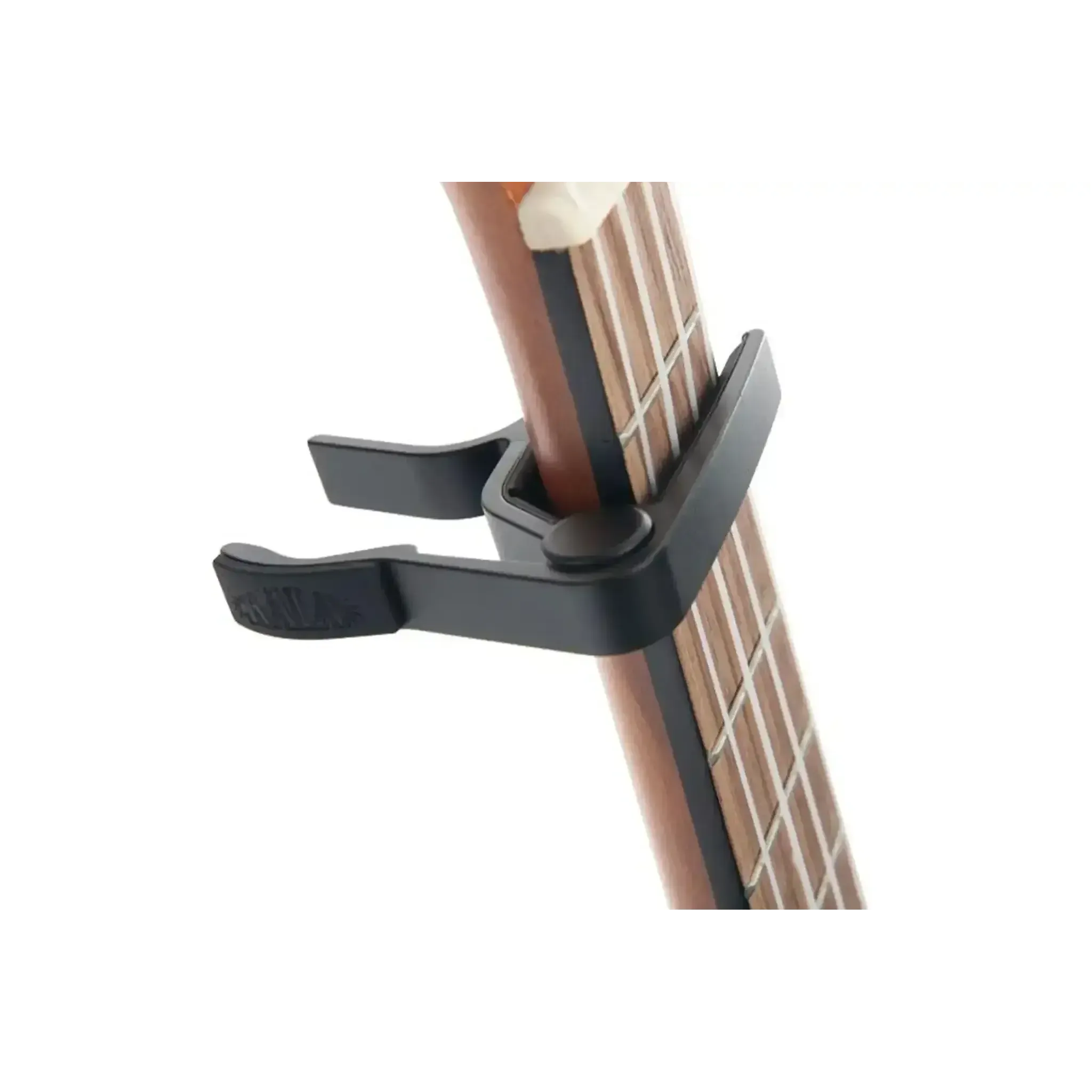 Kala K-CAPO-BLK black ukulele trigger capo on a ukulele neck, showing its curved radius design.