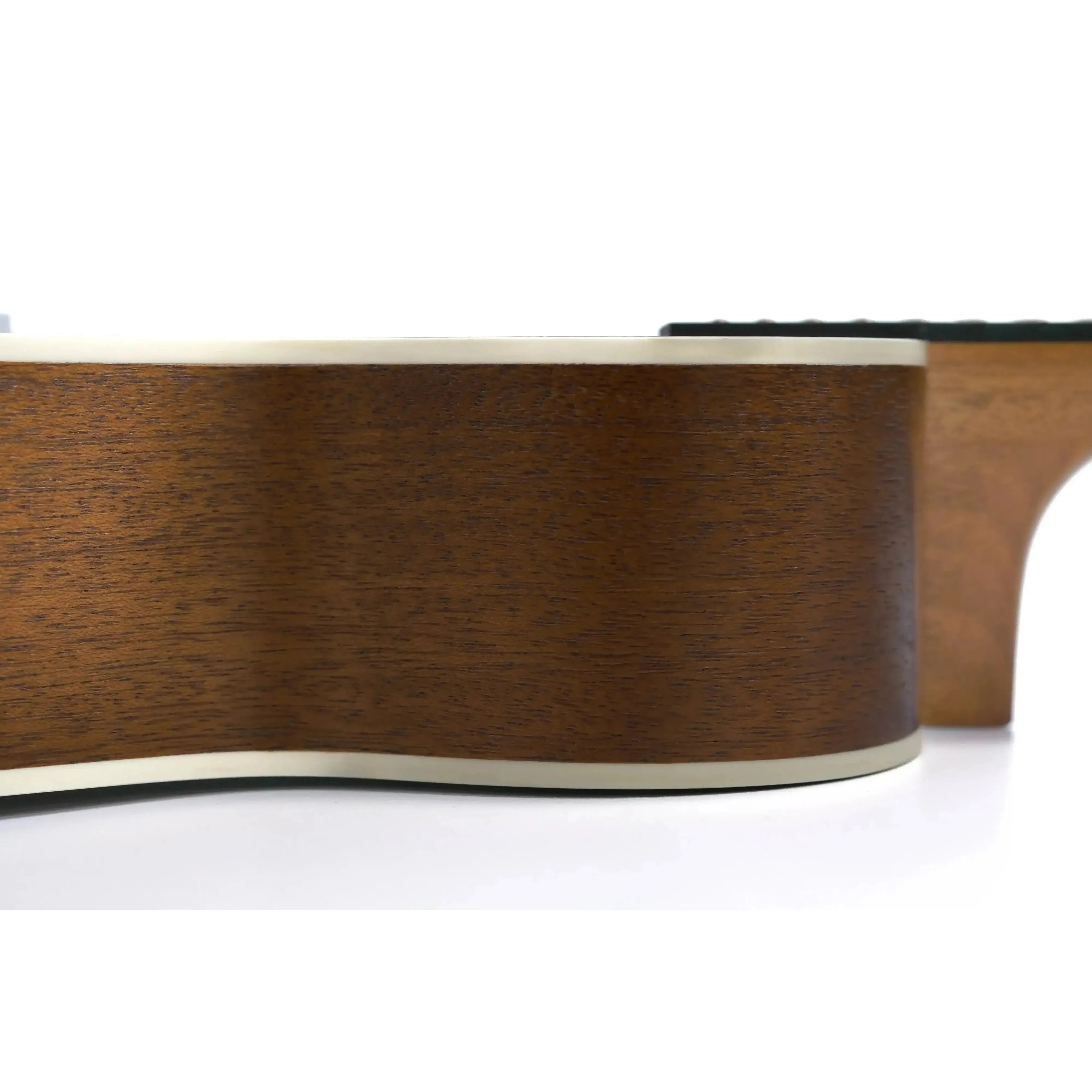 Kala KA-T Tenor Ukulele's satin mahogany body with cream binding, side view.