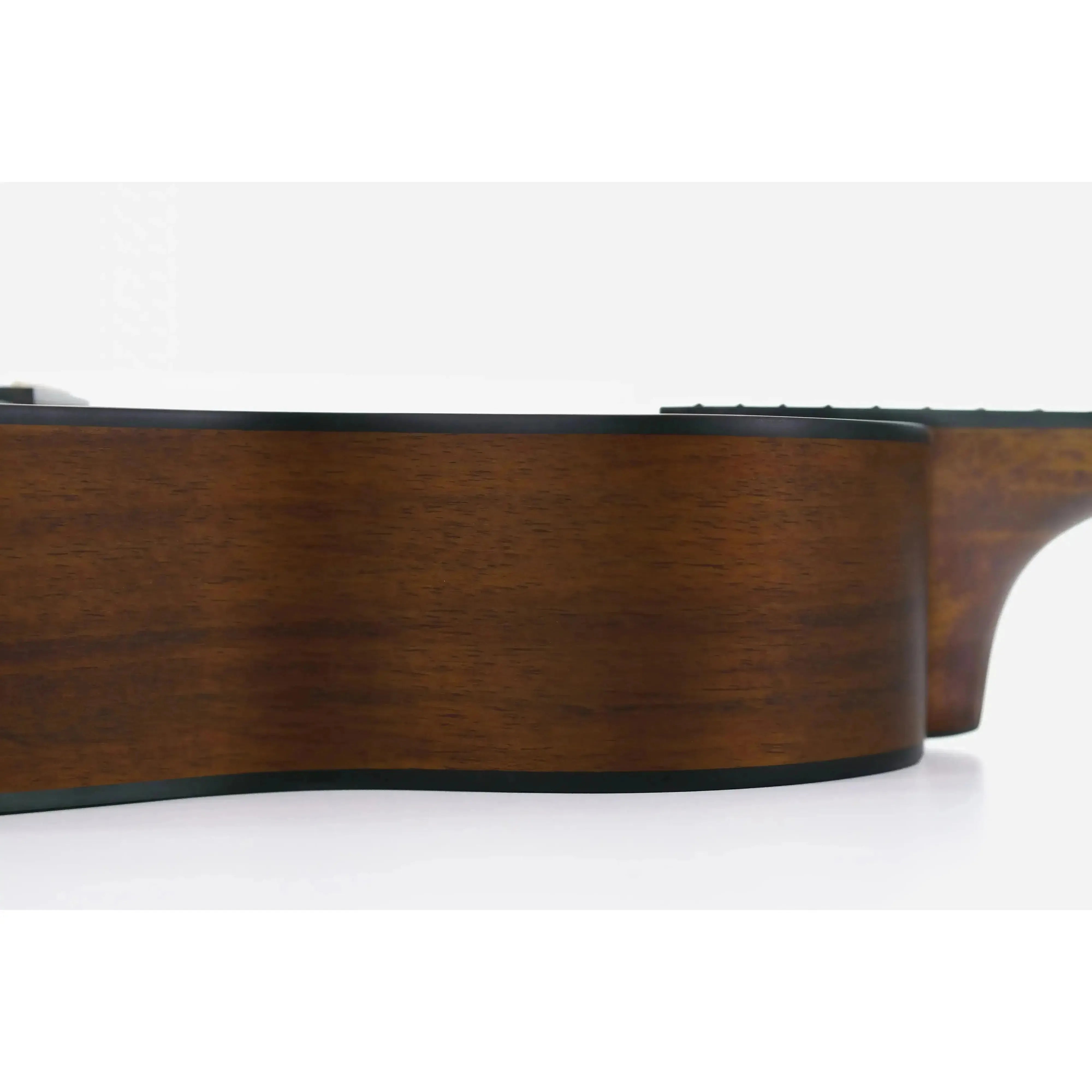 Side view of a Kala KOA-TE Hawaiian Koa Tenor Ukulele with dark wood grain and black binding.