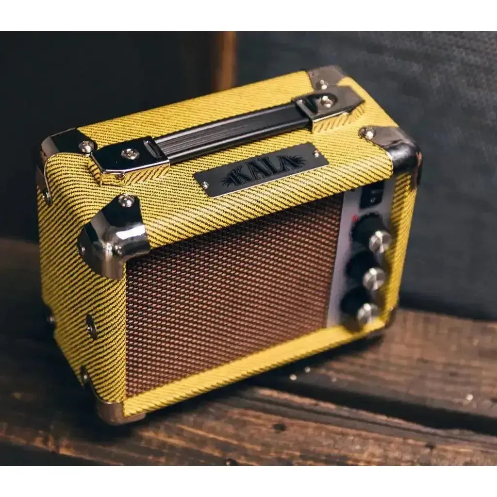 Kala Mini Tweed 5w acoustic ukulele amp in yellow tweed with chrome accents.
