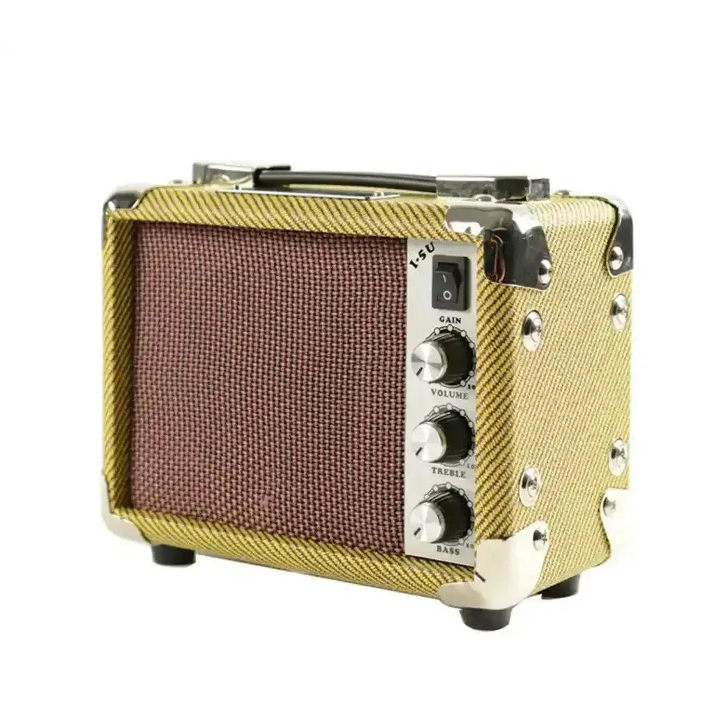 Kala Mini Tweed 5w acoustic amp with gold tweed casing, brown speaker grille, and silver controls.