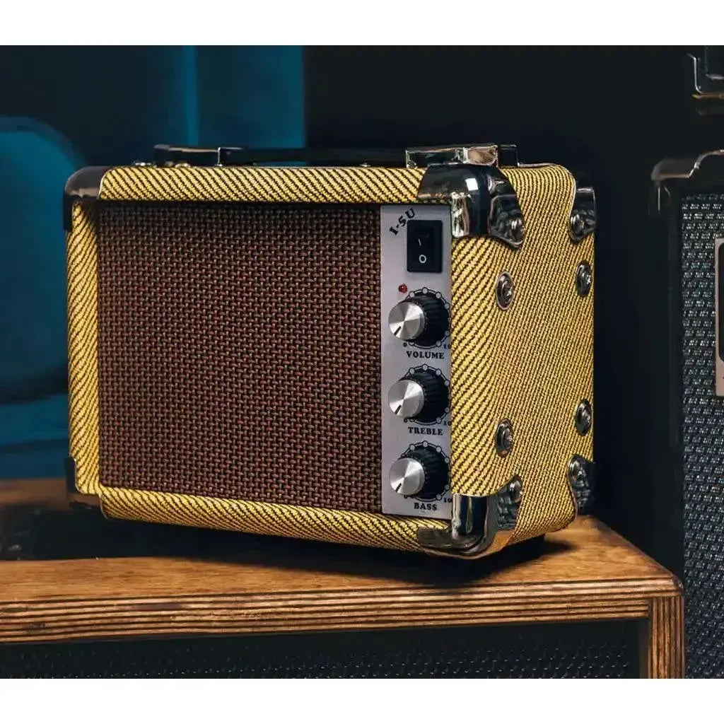 Kala Mini Tweed 5w acoustic amp with yellow tweed covering, brown speaker grille, and chrome hardware.