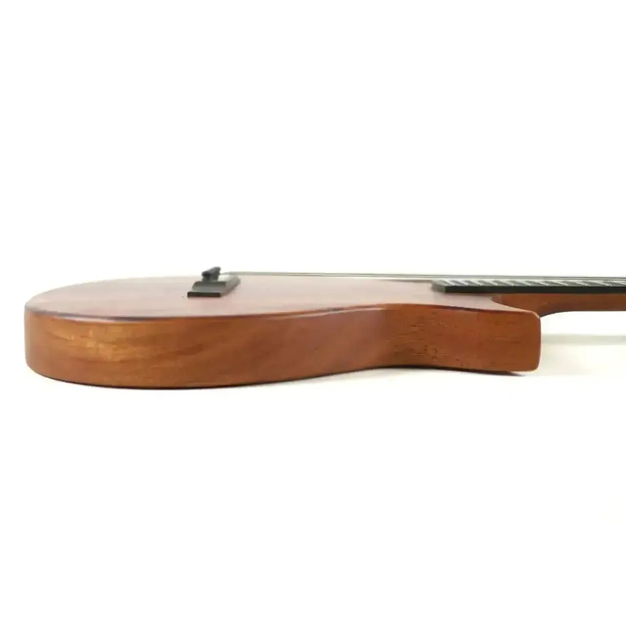 Side view of Kala Revelator Nautilus Baritone Ukulele, showing its Hawaiian Koa body and Florentine cutaway.
