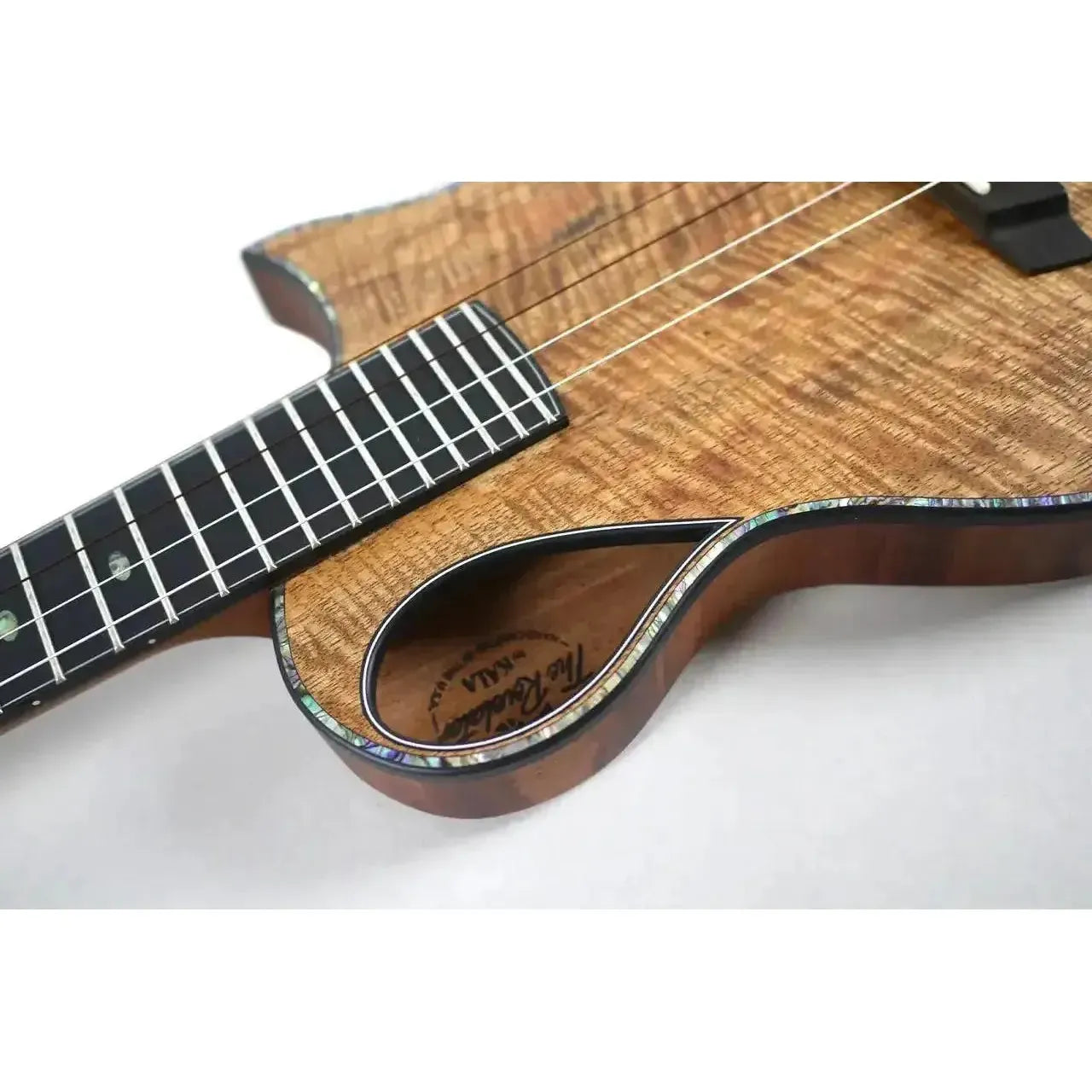 Kala NSL-T Emperor Revelator Tenor Ukulele with wavy mango top, abalone purfling, and Florentine cutaway.