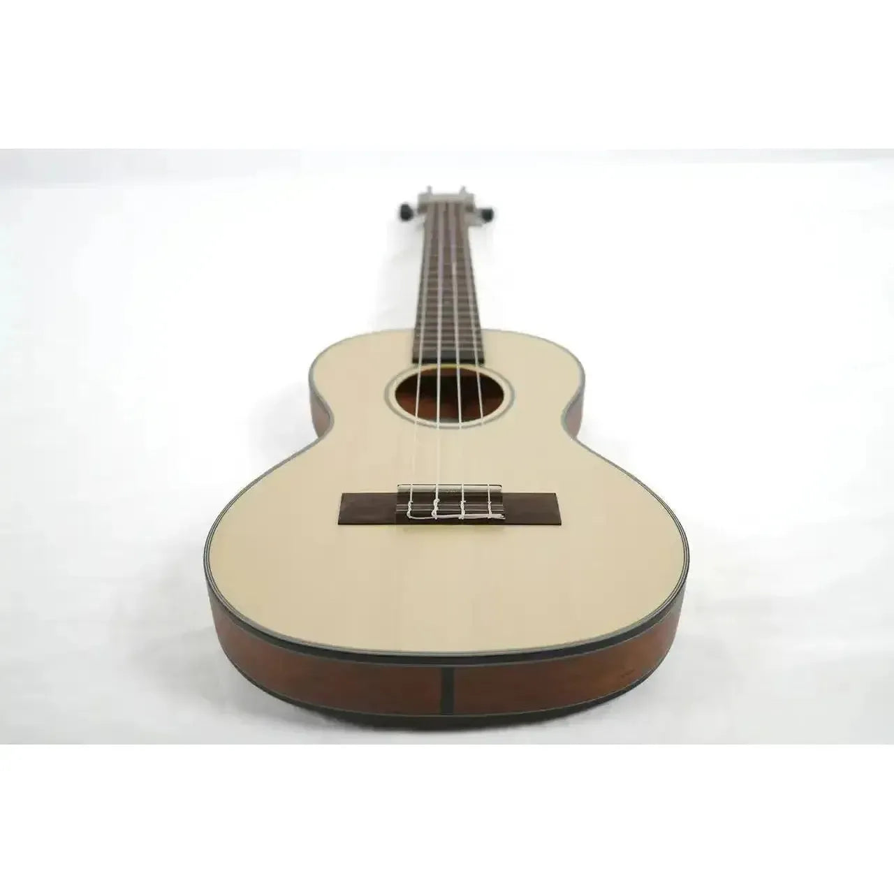 Kala Travel Thinbody Tenor Ukulele with solid spruce top and mahogany back, front view.