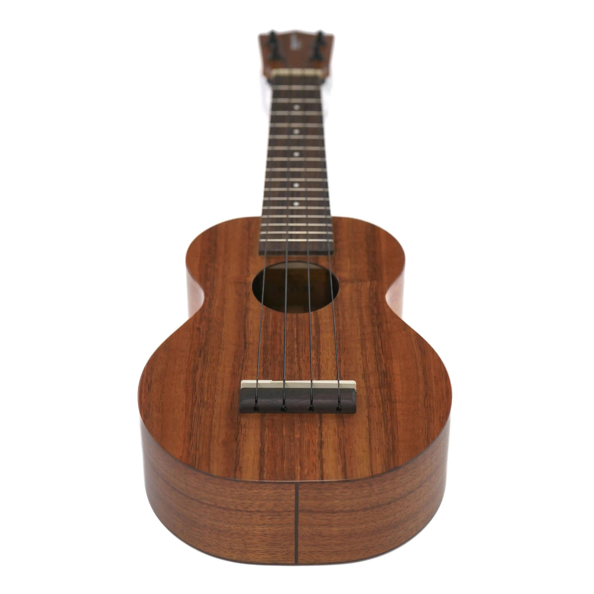 Kamaka HF-1 soprano ukulele full view at an angle showing the koa body, rosewood bridge and neck