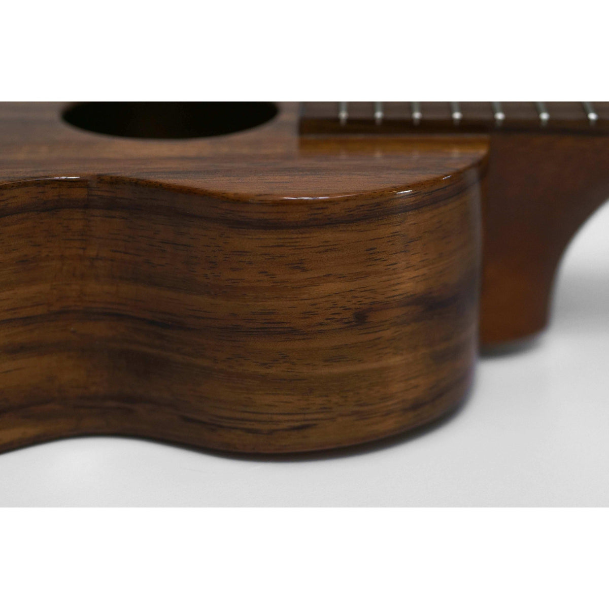 Pre-owned Kamaka HF-1 soprano ukulele side close-up of the koa side and neck heel