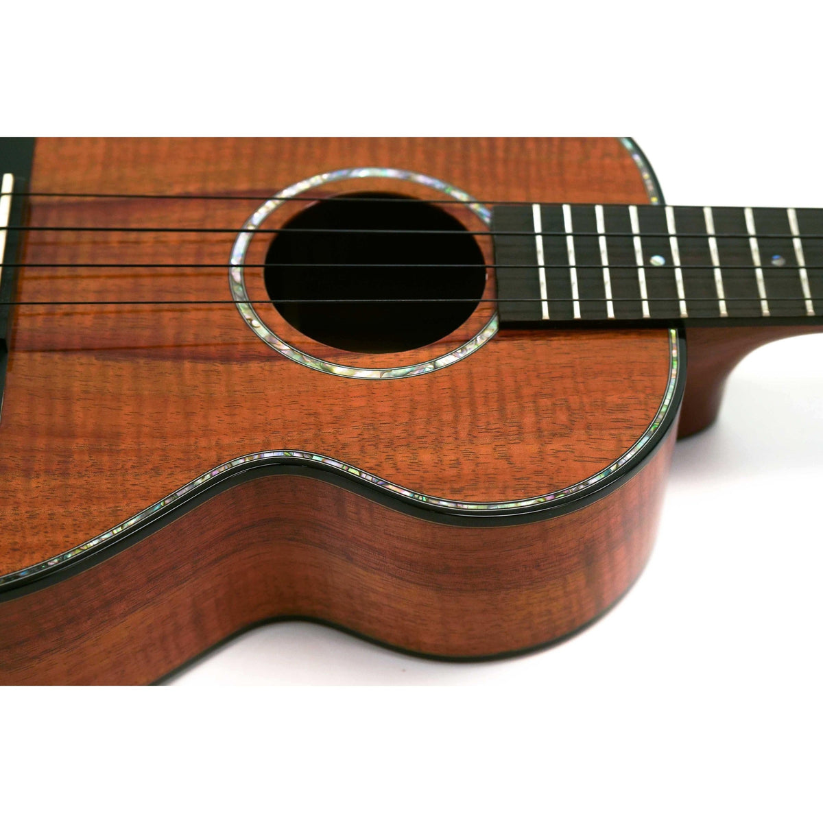 Kamaka HF-3-D2 tenor ukulele close-up of the abalone soundhole rosette, ebony fretboard and gloss koa side