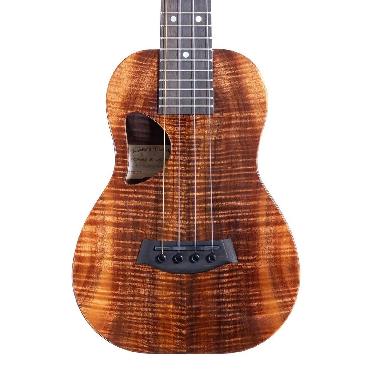 Example photo: an earlier Kanile'a D-1 Pro concert, body front with Premium Grade koa, oval side port, D-shaped soundhole and ebony bridge