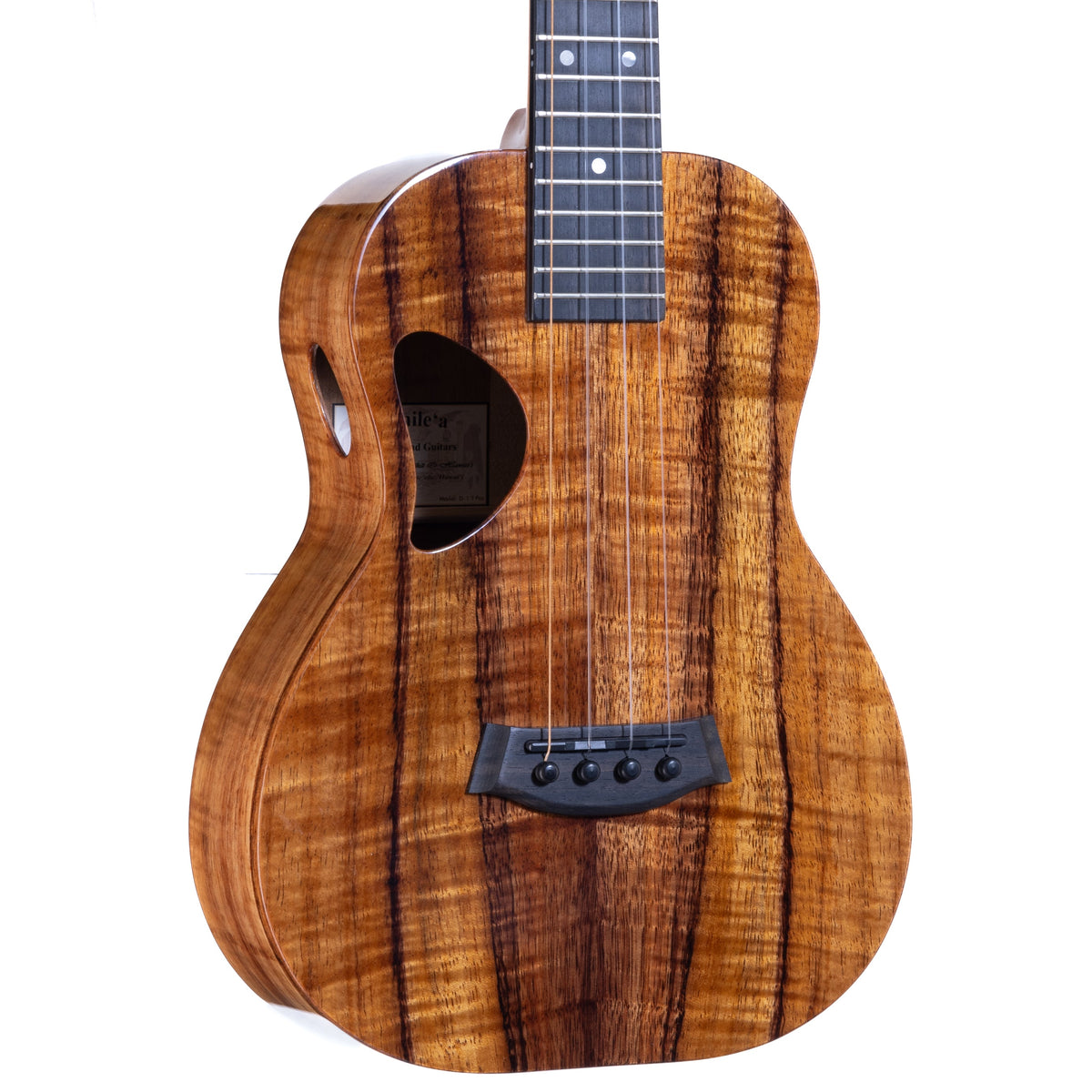 Close-up of the Hawaiian koa top, ebony bridge and D-shaped soundhole on Kanile'a D-1 Pro tenor ukulele, serial 30091