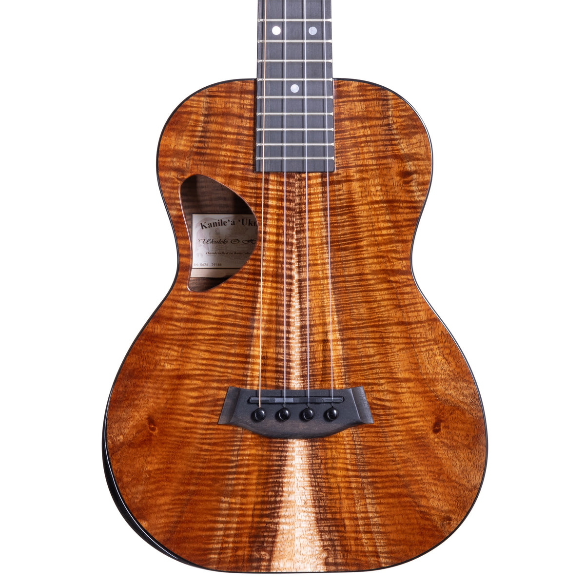 Example photo: a Kanile'a DK Pro tenor, serial 29188, body front with Master Grade koa, D-shaped soundhole and ebony armrest