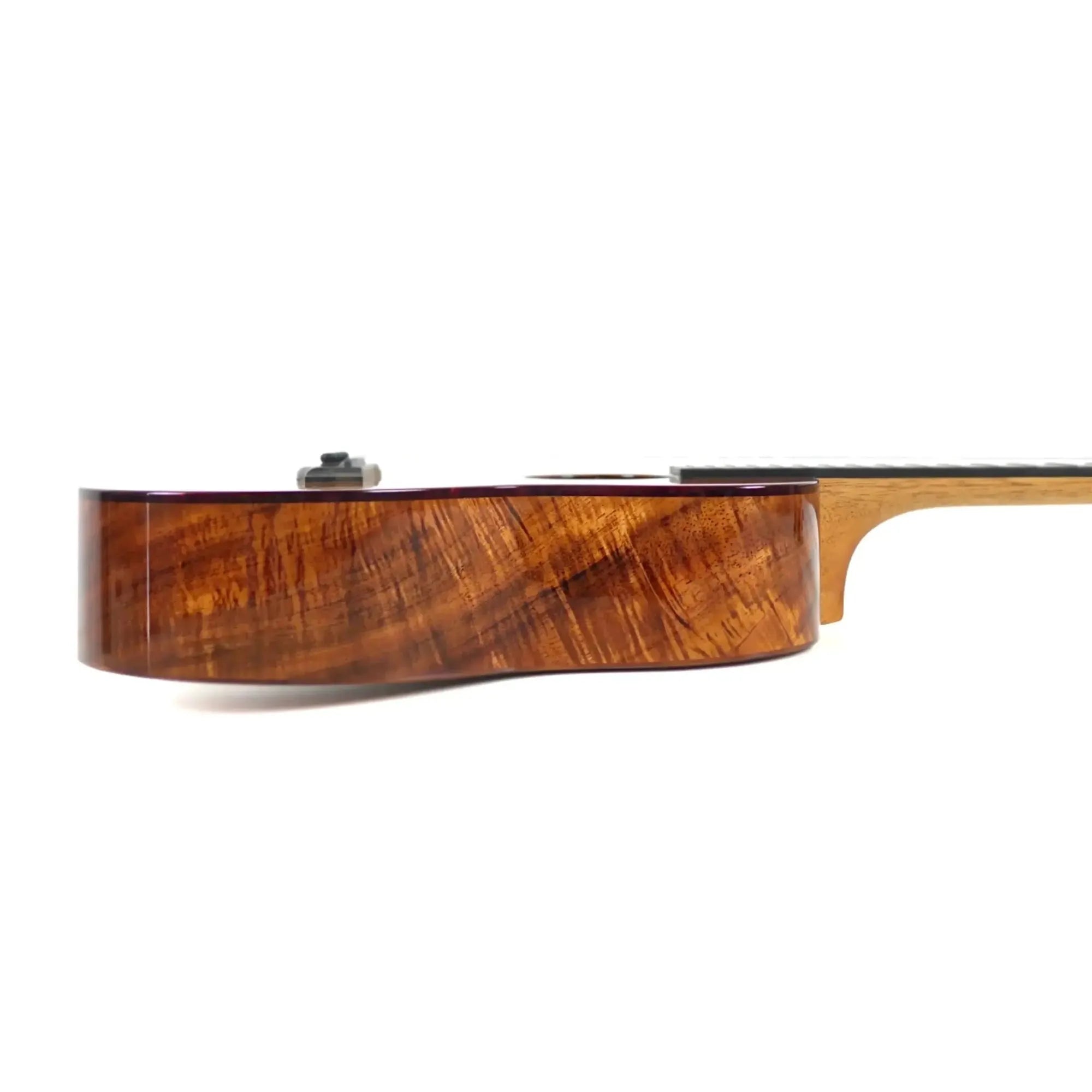 Kanile'a KPA-T Pro Premium Tenor Ukulele side view, showcasing the Hawaiian koa wood grain.