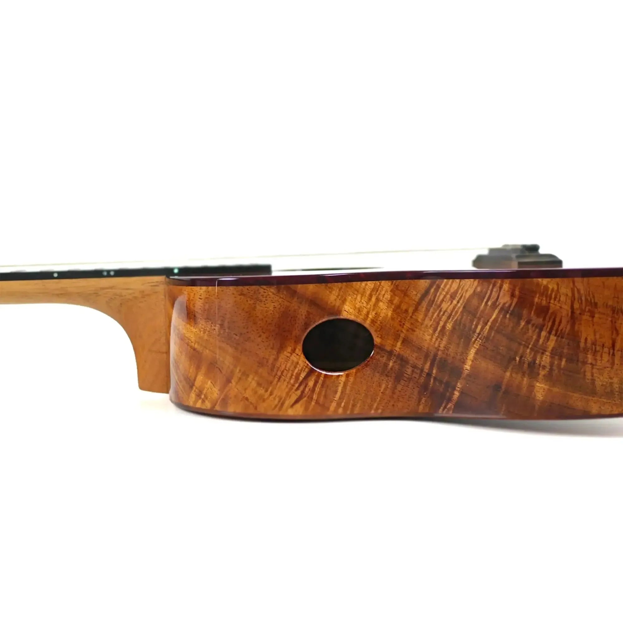Kanile'a KPA-T Pro Tenor Ukulele side view, showing premium Hawaiian koa wood with a sound port.