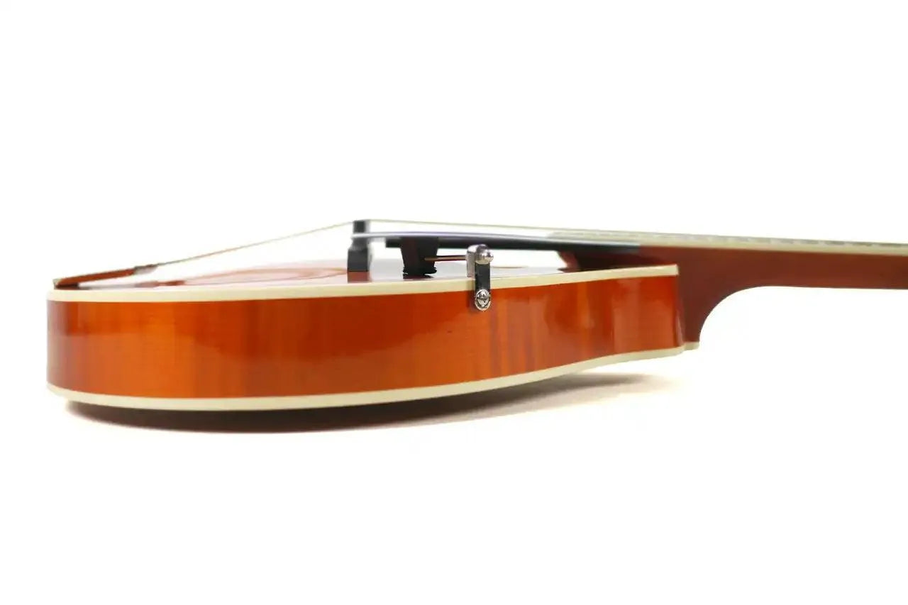Side view of a Kentucky KM-272 Amber Deluxe A-Model Mandolin with white binding and rosewood bridge.