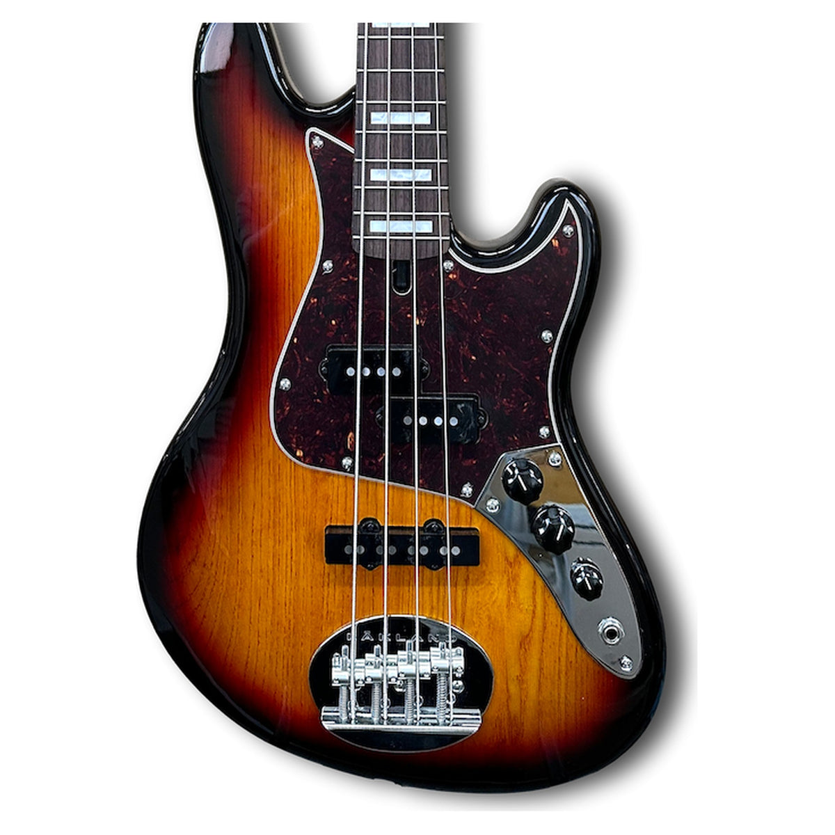 Lakland Skyline HH-30 body front in 3 tone sunburst over ash, with tortoise shell pickguard, P and J pickups and rosewood fingerboard with pearl blocks