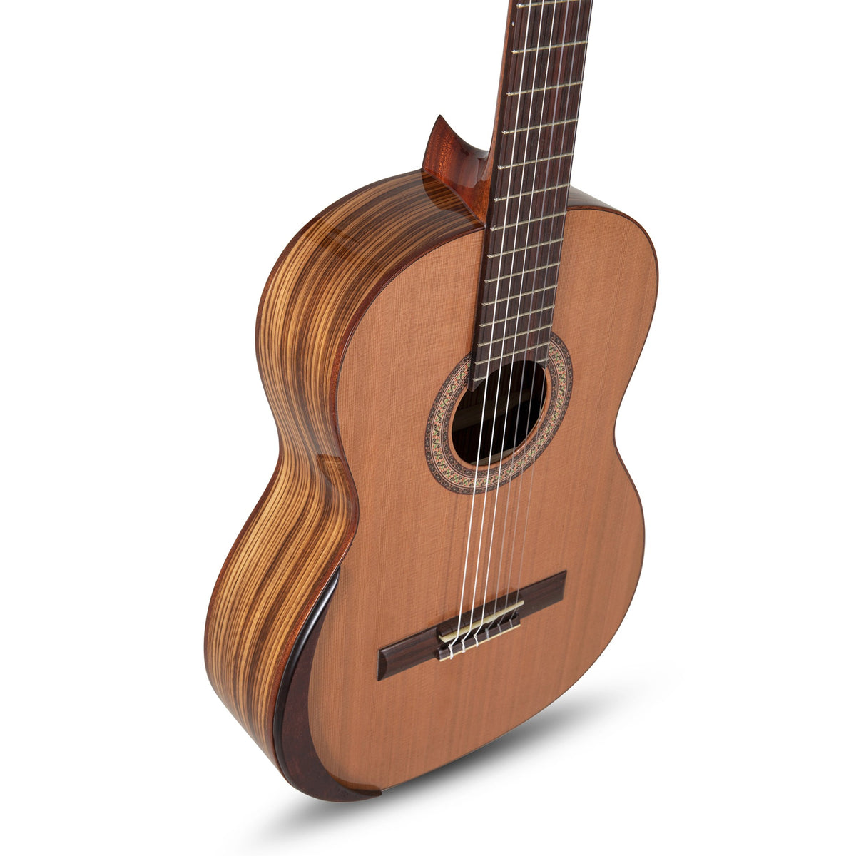 Angled view of the Manuel Rodriguez Academia 40-C classical guitar showing the cedar top and zebrano sides
