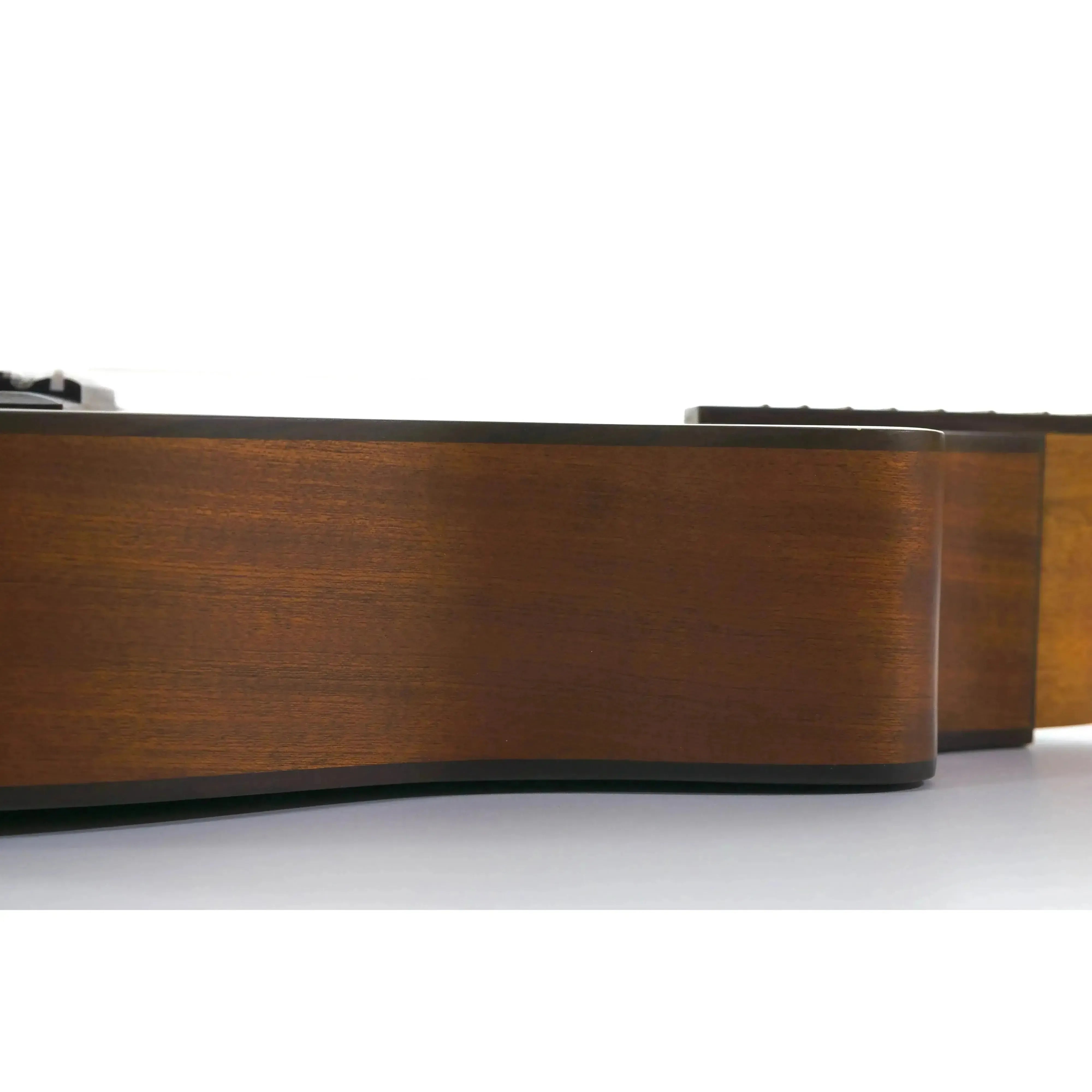 Side view of an Ohana BK-35CE solid mahogany baritone ukulele, showcasing its rich brown wood grain and satin finish.