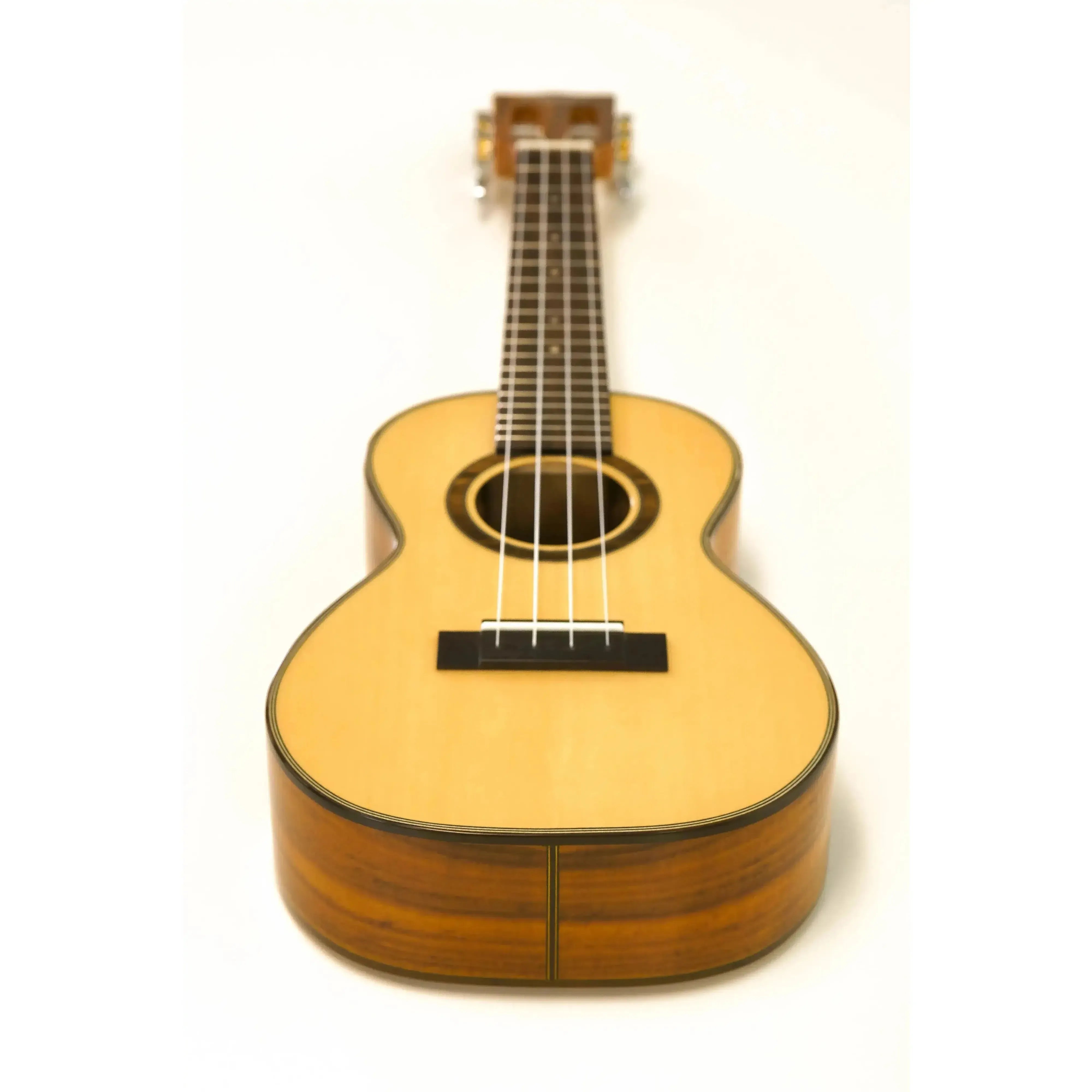Ohana CK-250G Concert Ukulele with light spruce top, dark acacia sides, and gloss finish.