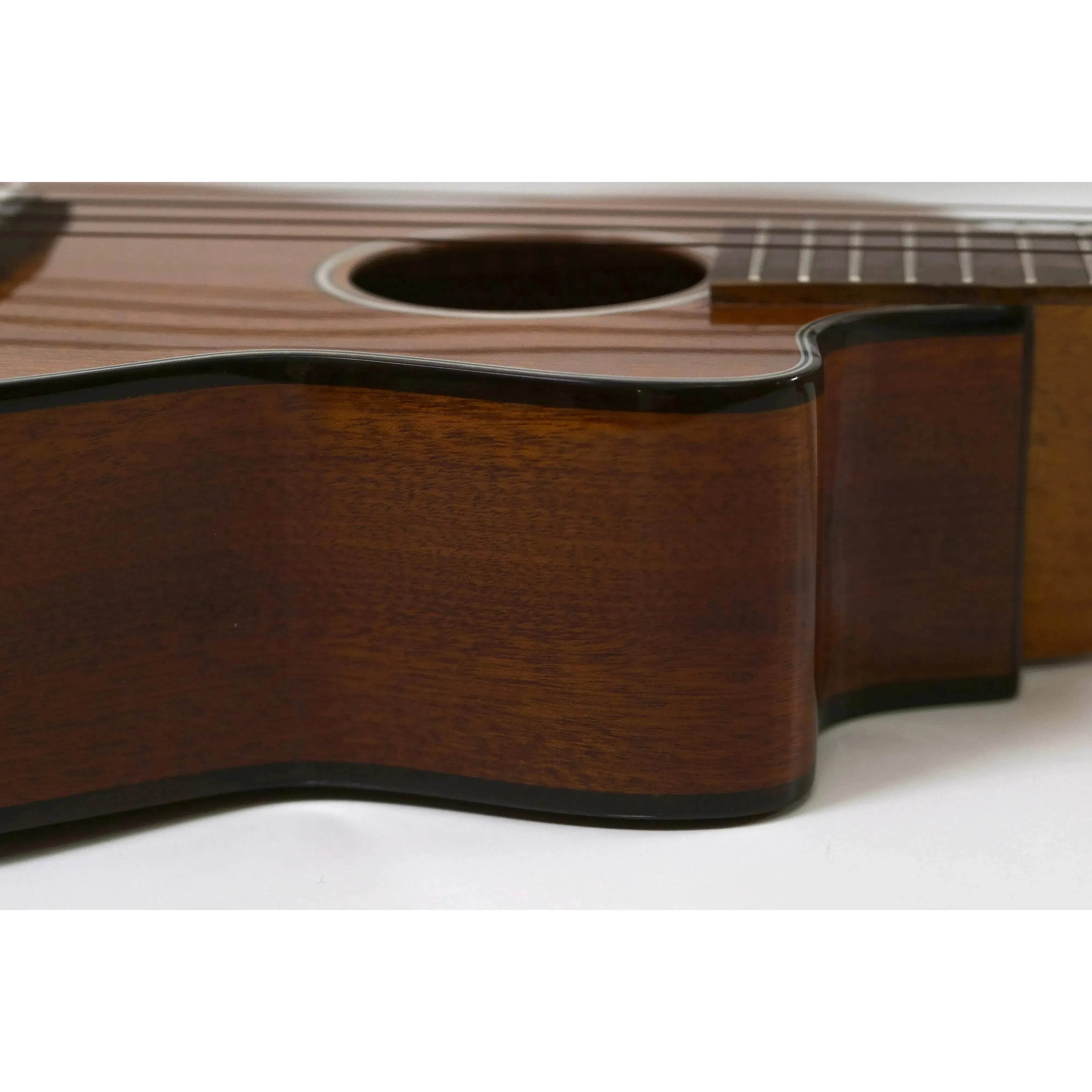 Ohana CK-35CG-CL Concert Ukulele body, showing its solid mahogany wood, gloss finish, and black binding.