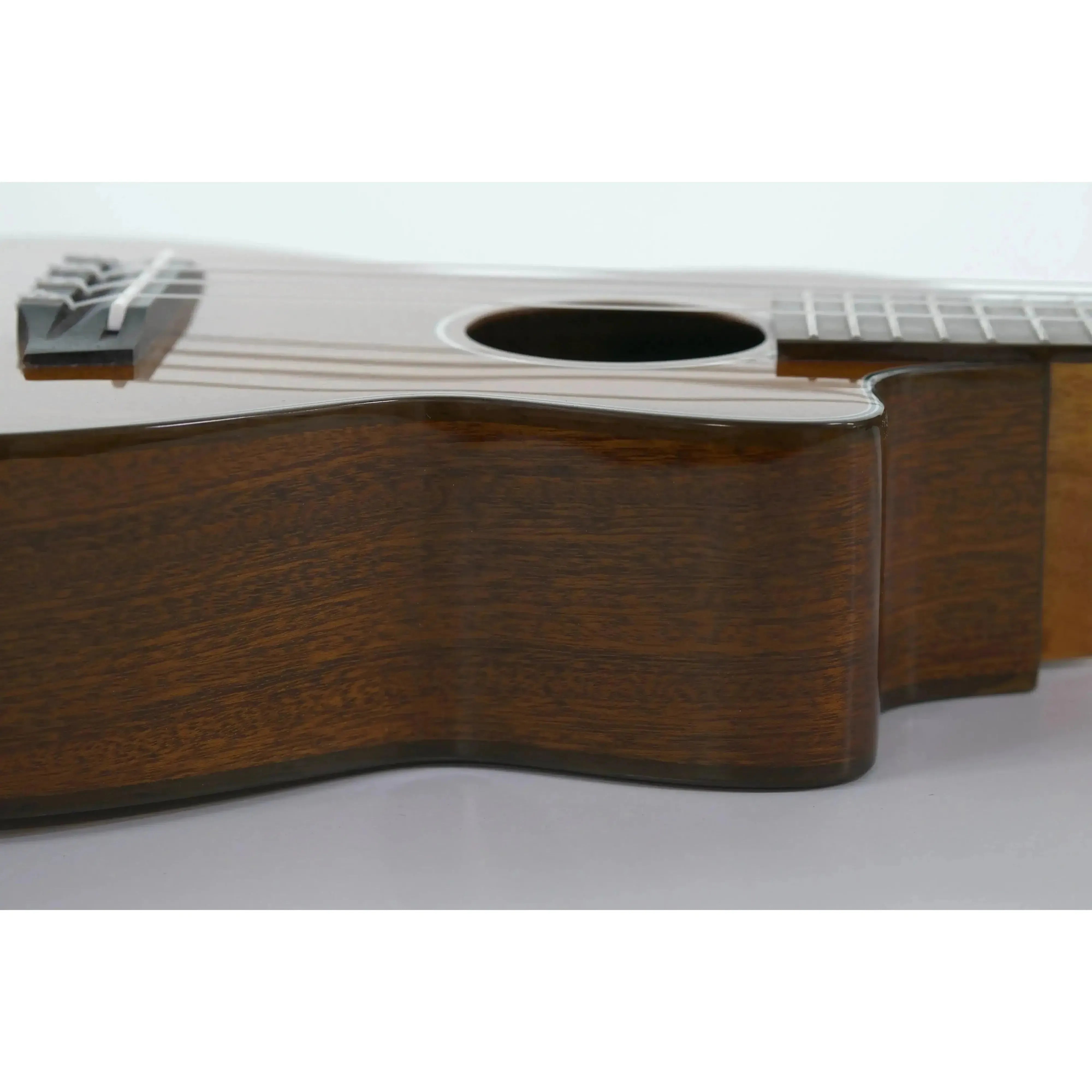 Ohana CK-35GCE solid mahogany concert ukulele body with gloss finish and cut-away design.
