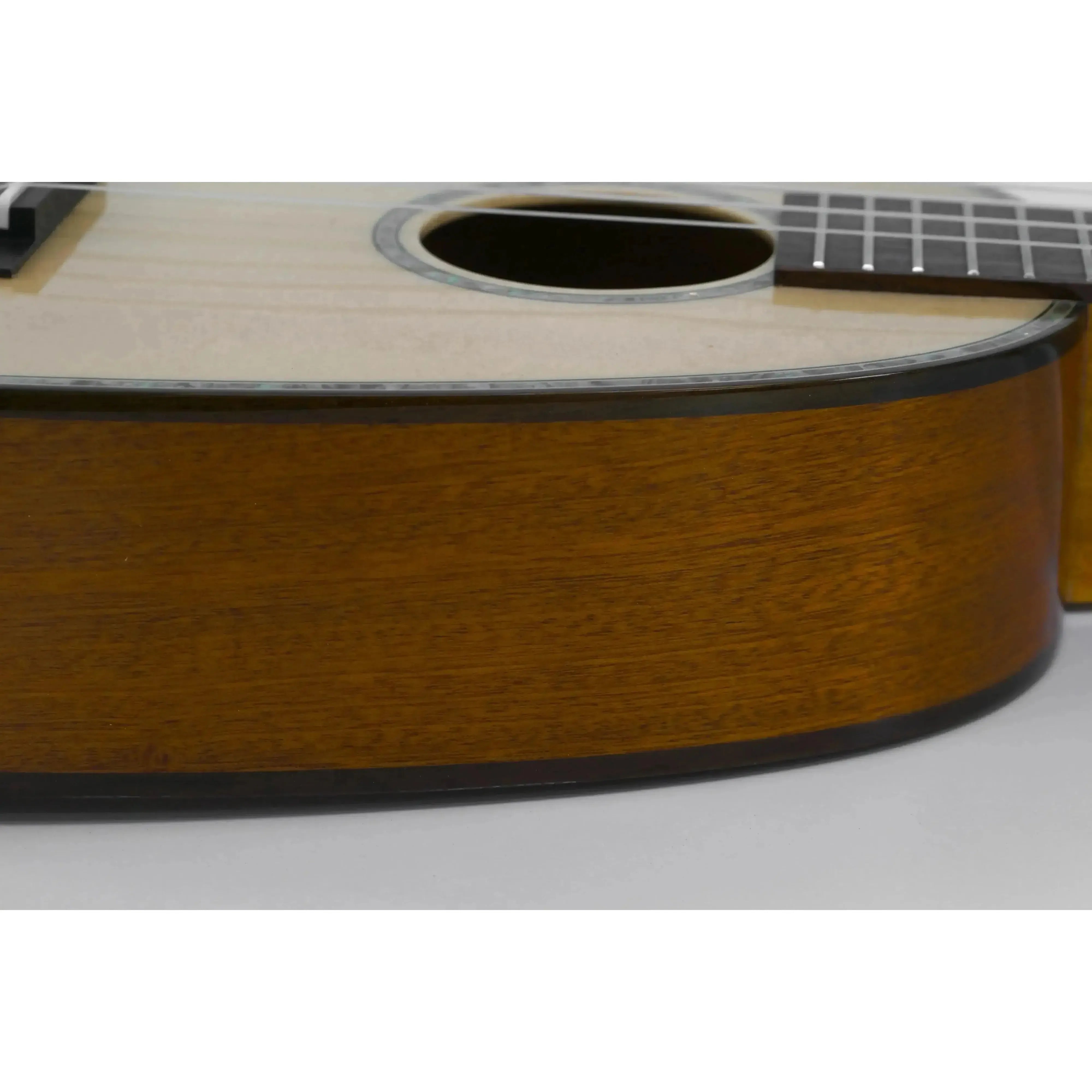 Ohana PK-70G pineapple soprano ukulele body with light spruce top and dark mahogany sides.